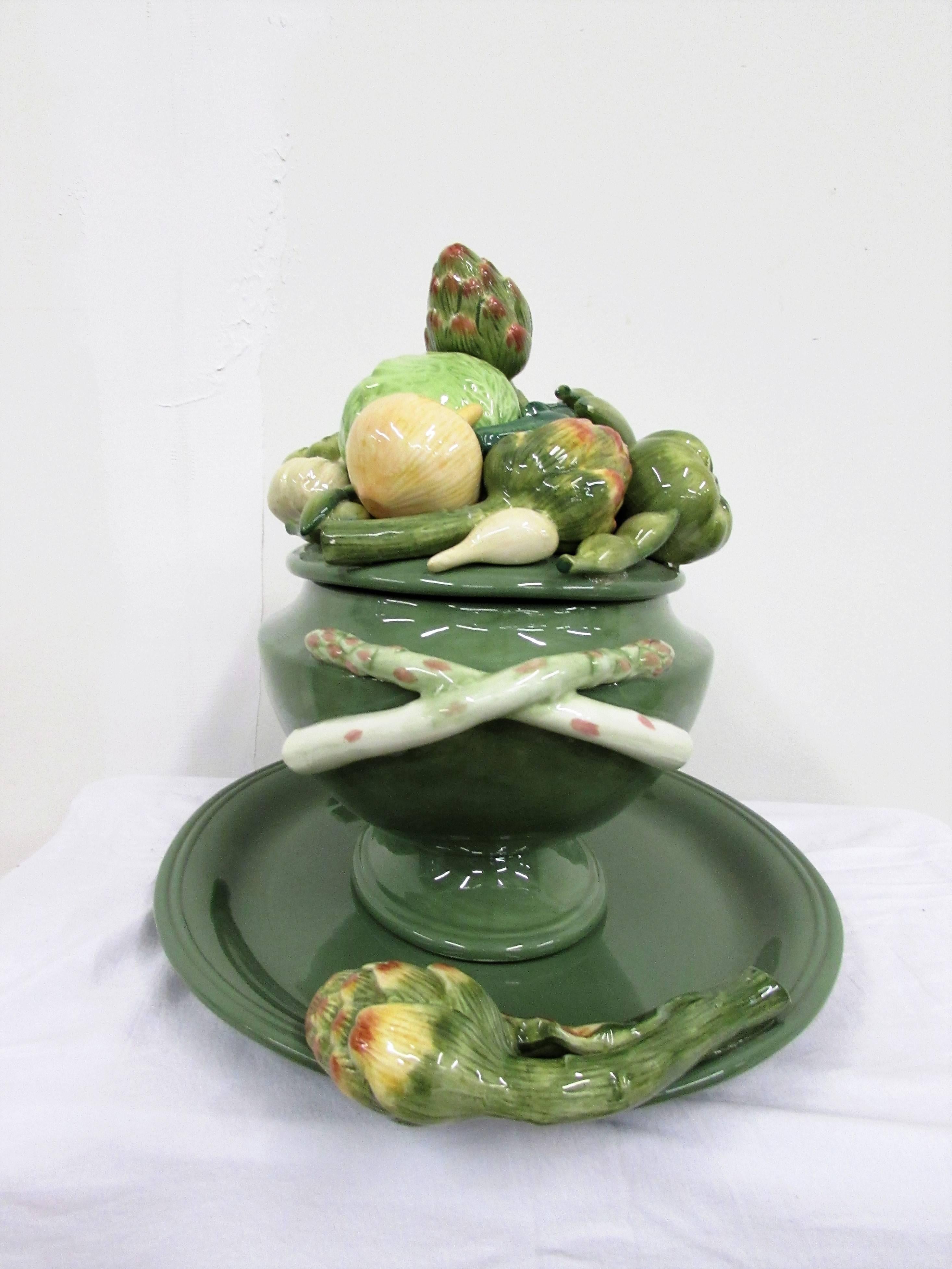 Fitz and Floyd 1960s giardino faience tureen with fanciful shapes of vegetables in colored glazing with ladle and platter made en suite.
