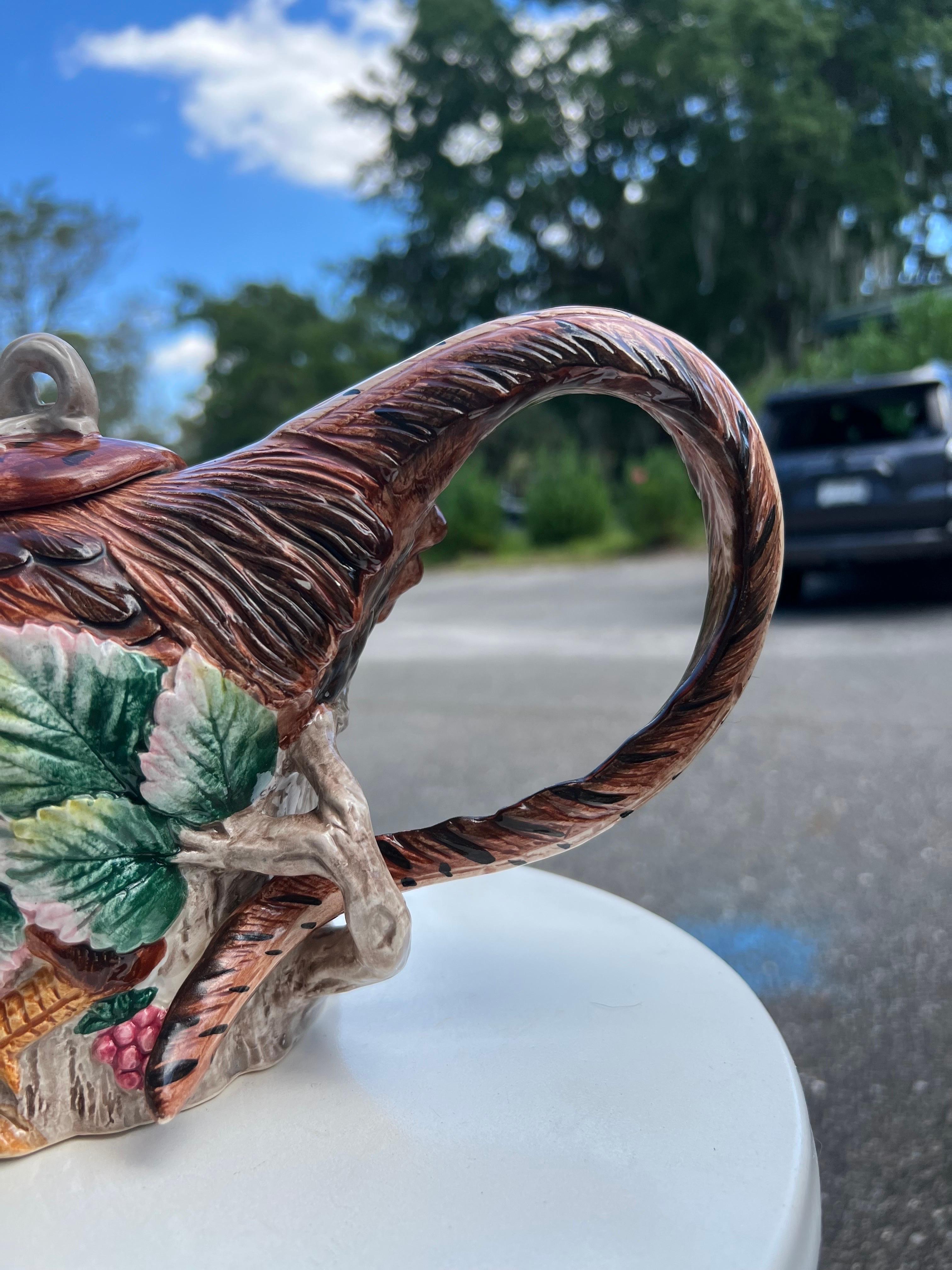 This is a Fitz and Floyd  28 oz teapot in the shape of a pheasant. It is dated 1990 and retains the original price sticker, Fitz and Floyd Sticker and a Hand Painted sticker.  It has a clever design with the spout being the pheasants beak and the