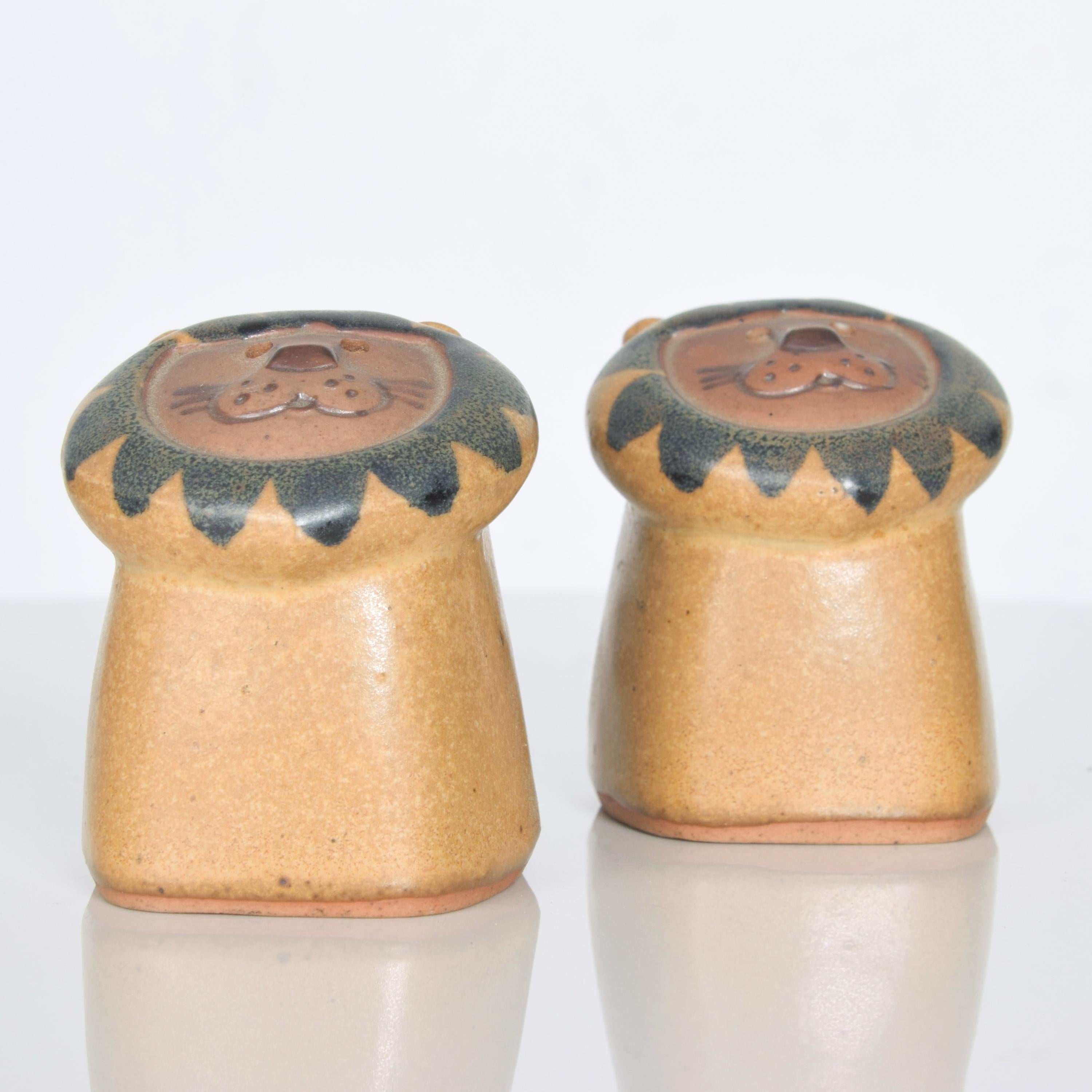 Fitz & Floyd Japan pottery stoneware lion face salt pepper shaker set 1970s Vintage Modern.
In the Swedish Gustavsberg sculptural pottery style of Lisa Larson Sweden
2 3/4 H x 2 1/4 W x 2D
Original unrestored vintage condition. 
Refer to images