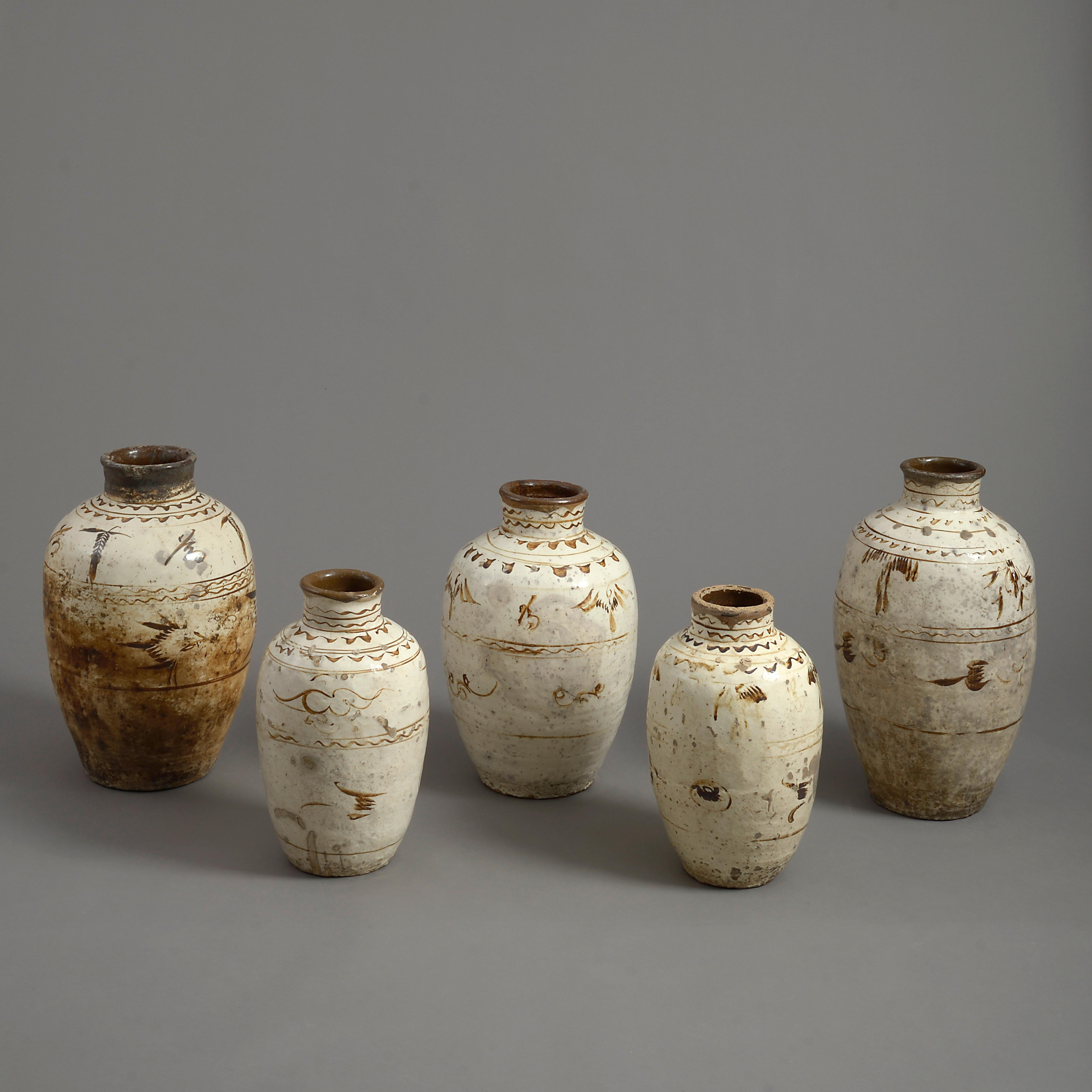 Five sixteenth century cream and caramel glazed Cizhou pottery vases.

Ming Period

Dimensions refer to tallest vase.