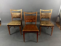 Five 1940s Continental Leather and Oak Dining Chairs