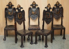 FIVE 19TH CENTURY CARVED CONTINENTAL BAROQUE DOUBLE EAGLE COAT OF ARMS CHAIRs
