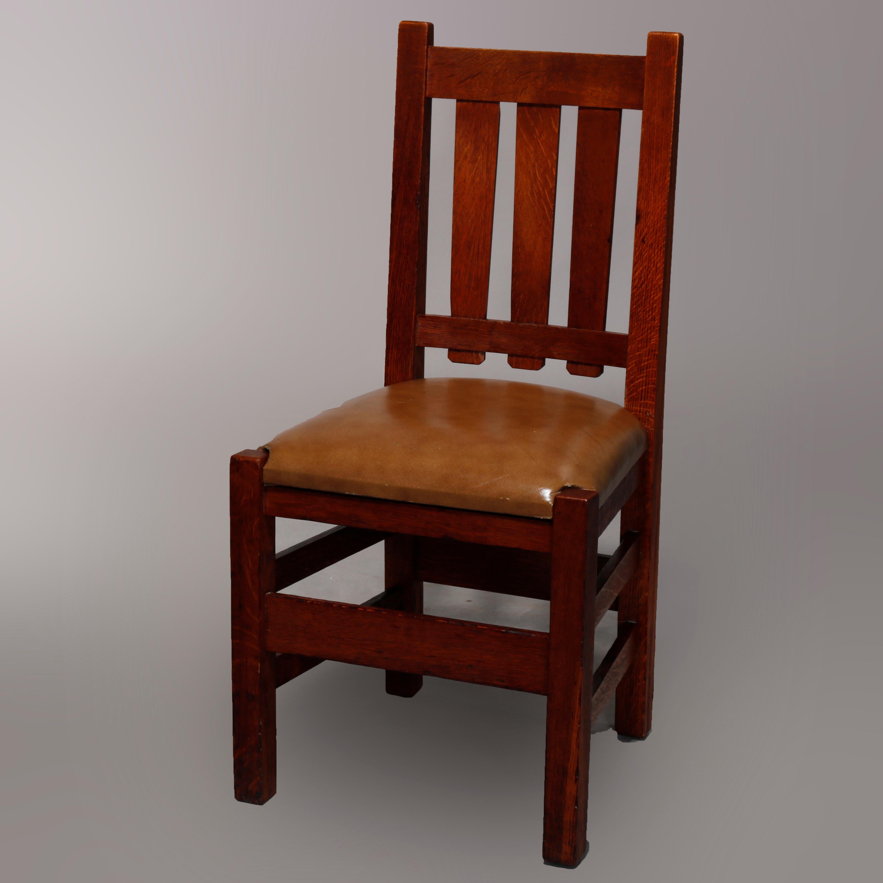 An antique set of five Arts and Crafts Mission Oak dining chairs attributed to Stickley Bros. offer quarter sawn oak construction with slat backs, leather seats and raised on square and straight legs, unmarked, c1910.

Measures: 37.75