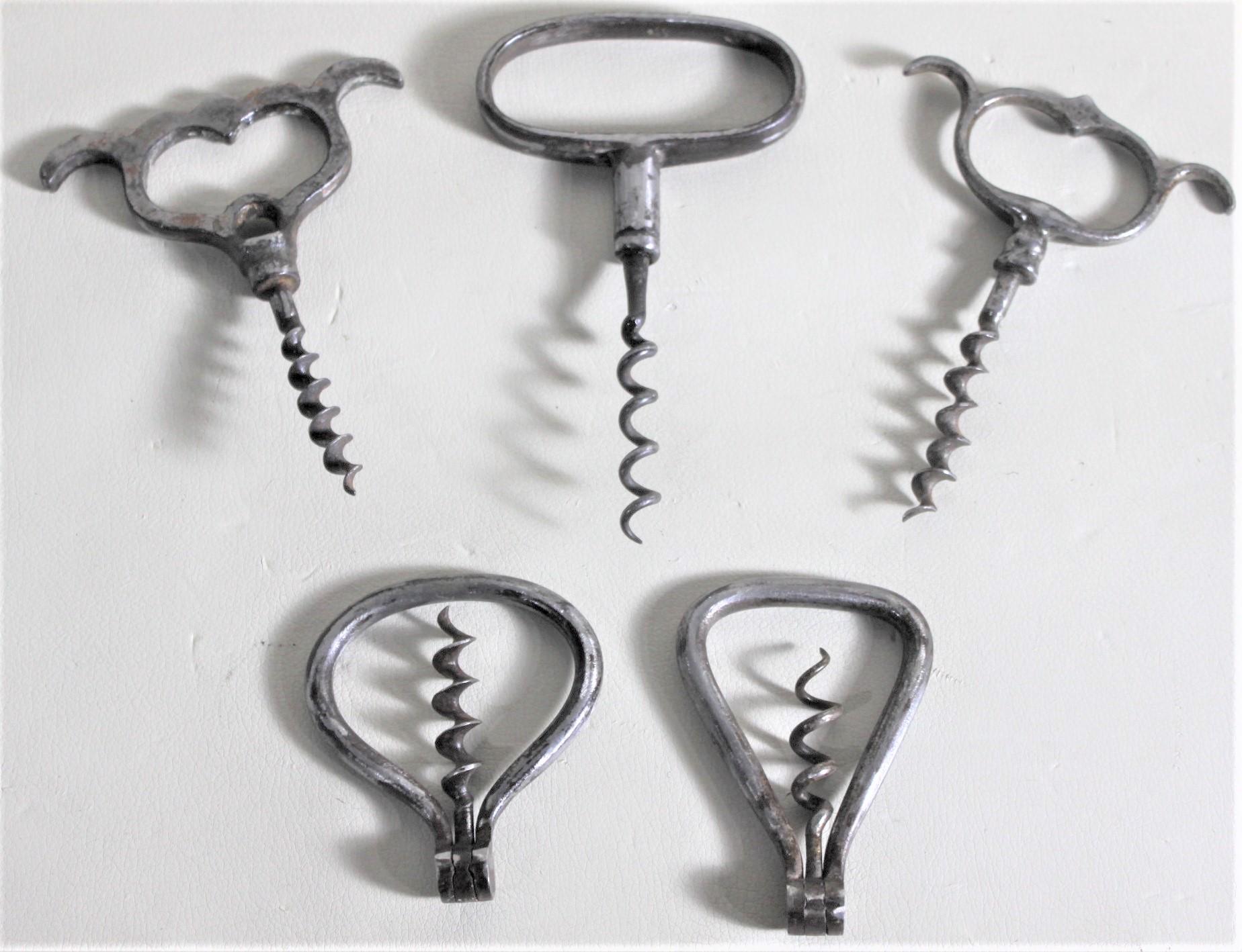This collection of five vintage corkscrews are all unmarked and unsigned, but presumed to originate from the United States and England and date to circa 1920 and made in the period Art Deco style. The corkscrews are the oldest and most basic 'tried