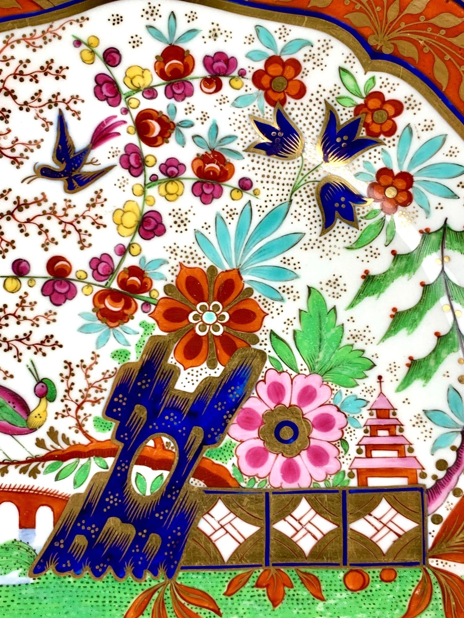 These antique English porcelain plates were made at the Royal Porcelain Works, Worcester, by Barr, Flight & Barr between 1807 and 1813.
Each plate is hand-painted in Worcester’s celebrated “Fence” pattern, a chinoiserie garden scene of blossoming