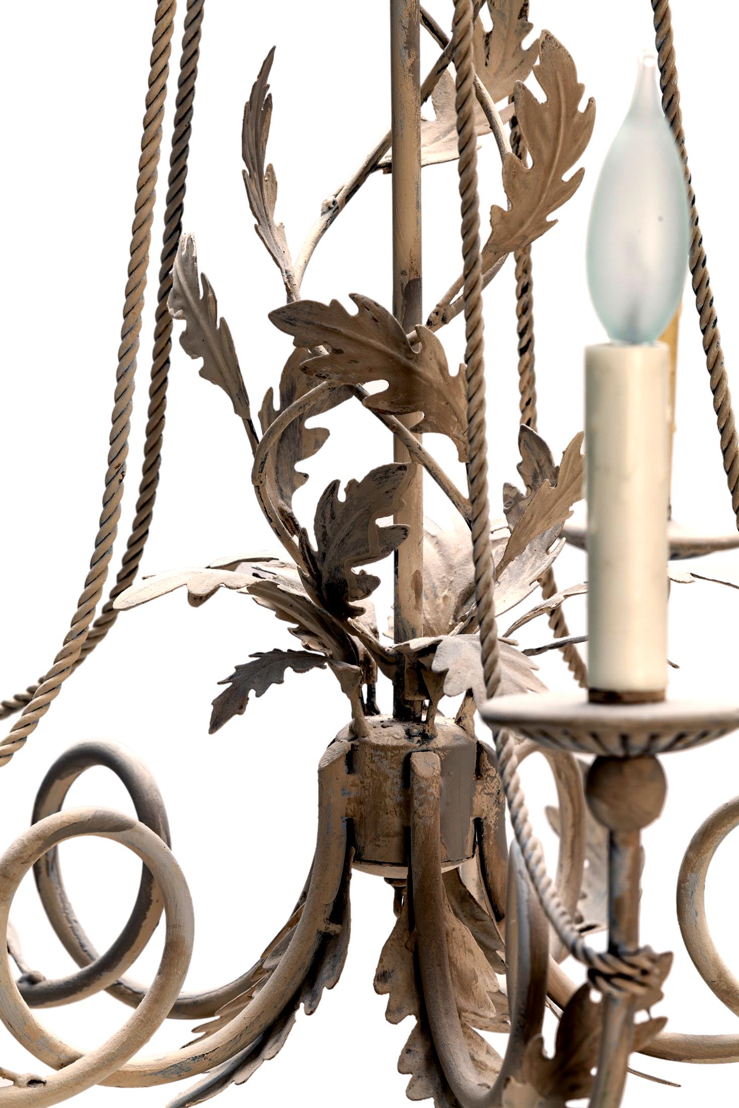 Hand-painted five arm chandelier w central oak leaf spiral.
Twisted rope accent lead to each arm.
Wood candle cups with natural wax candle covers.
