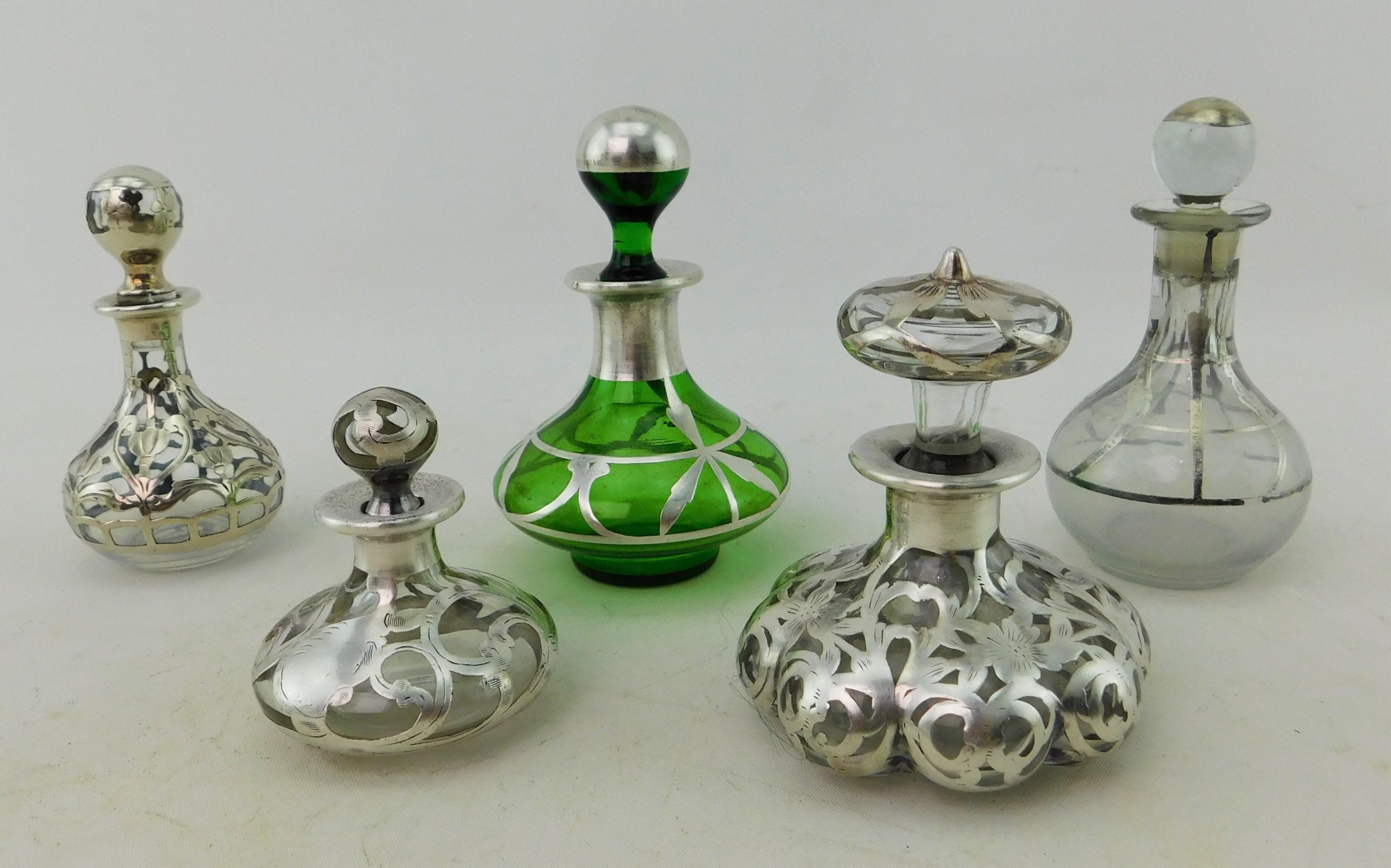 European Five Art Nouveau Perfume Bottles circa 1900 Silver Overlay on Glass 19th Century For Sale