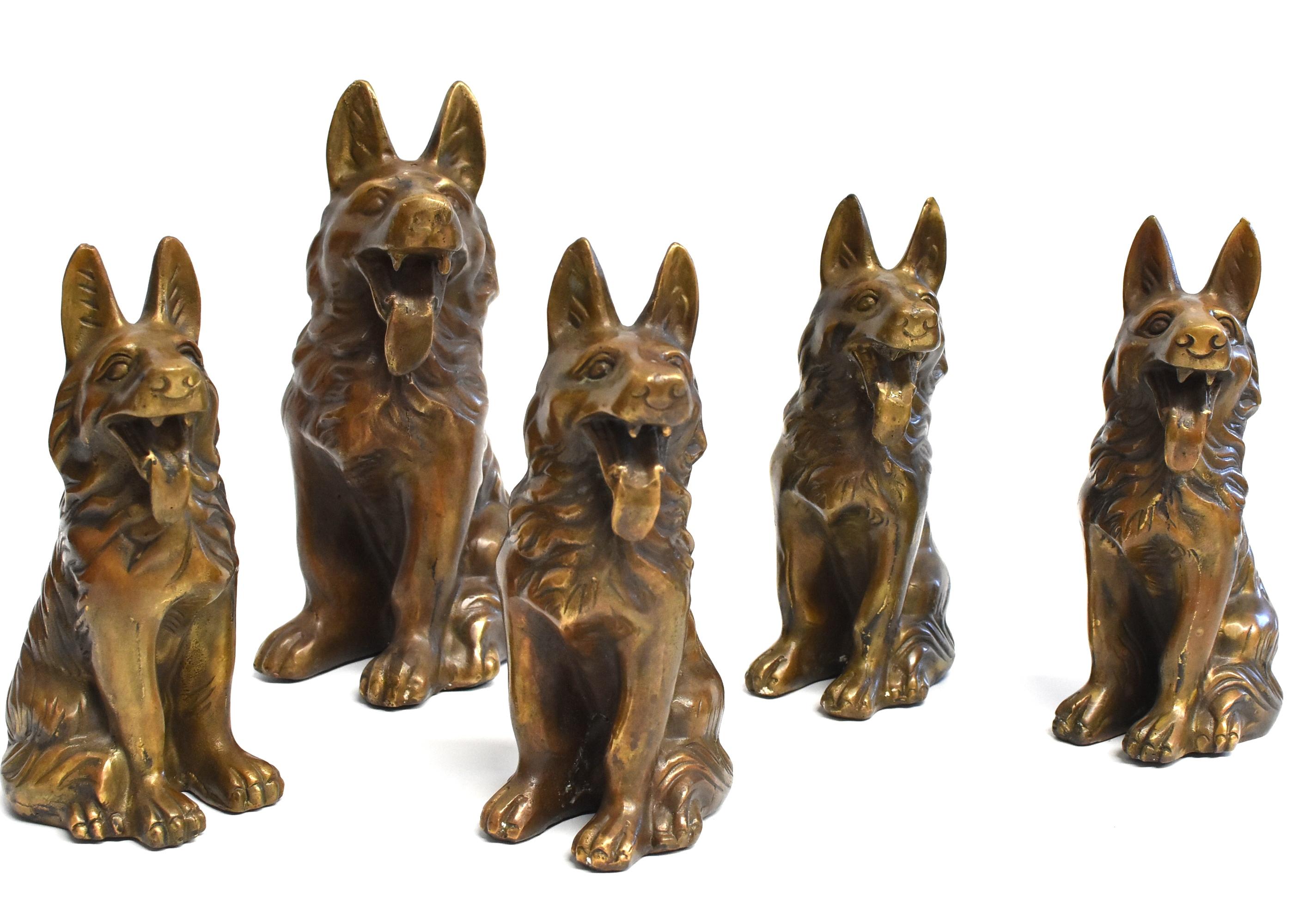A wonderful set of brass dogs, German Shepherds. Vivid and expressive, with well defined facial features and hair. There are 1 large dog and 4 medium size dogs. These pieces are great as a groups of sculptures and paperweights. Large: 5.25