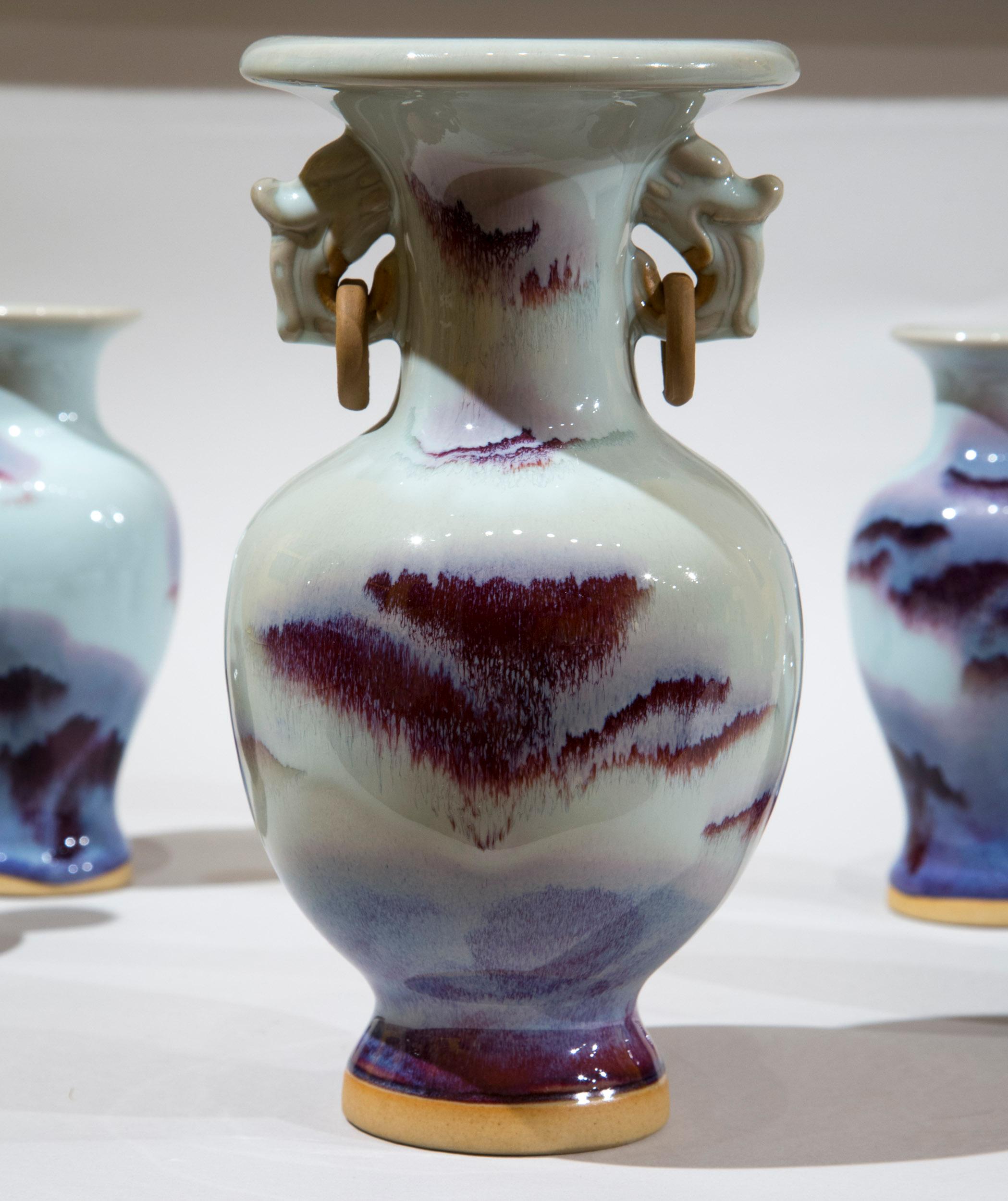 A highly decorative collection of five Song dynasty style 'Jun Ware' vases, glazed in moon white with purple.

China, 20th century.

Measurements
largest vase:
Height 21.5 cm / 8.5 in
smaller vases:
Height 15.5 cm / 6 in.
  