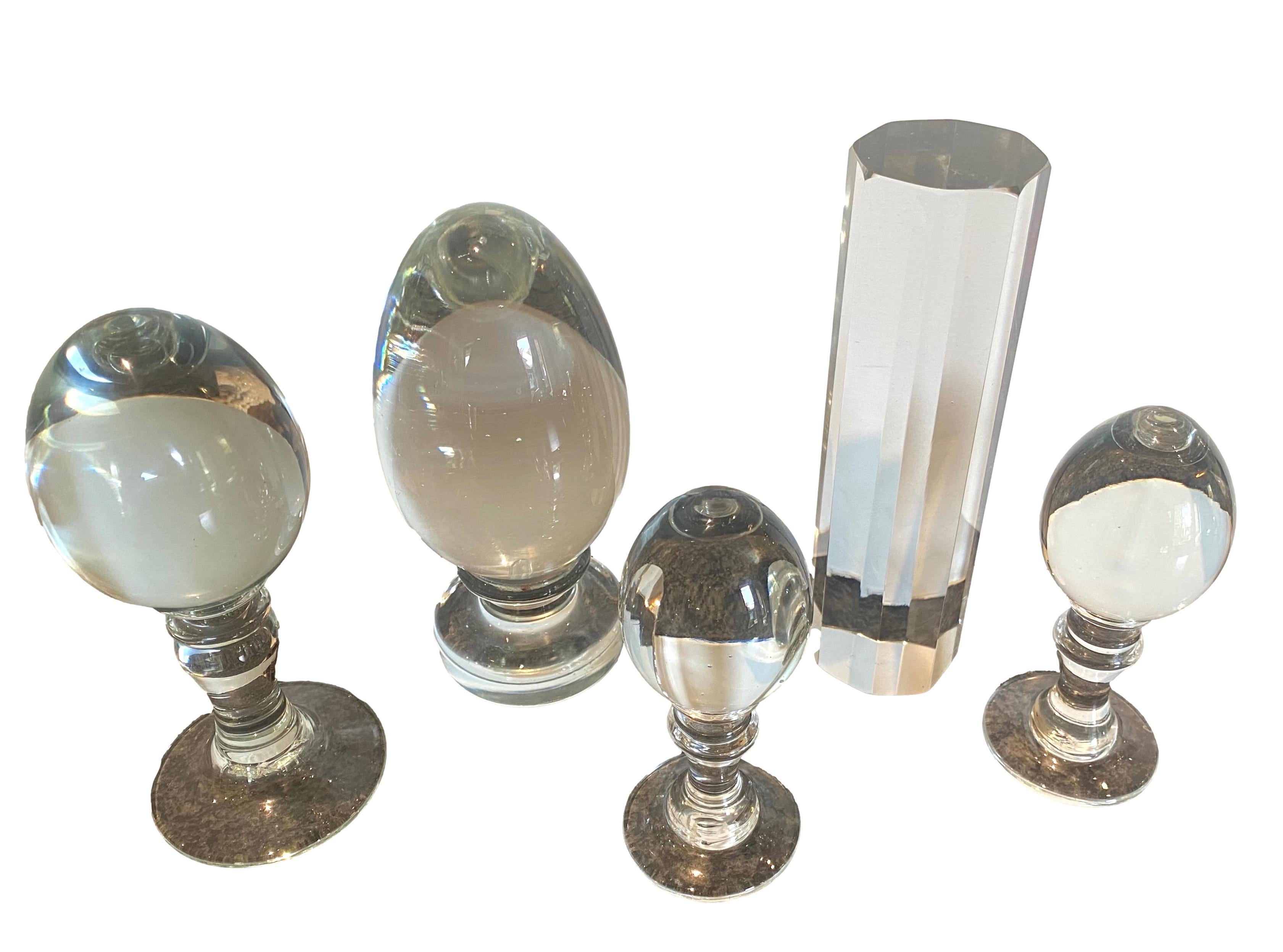 5 crystal paperweights or table top ornaments.
The pieces separately measure:
1. 5.5