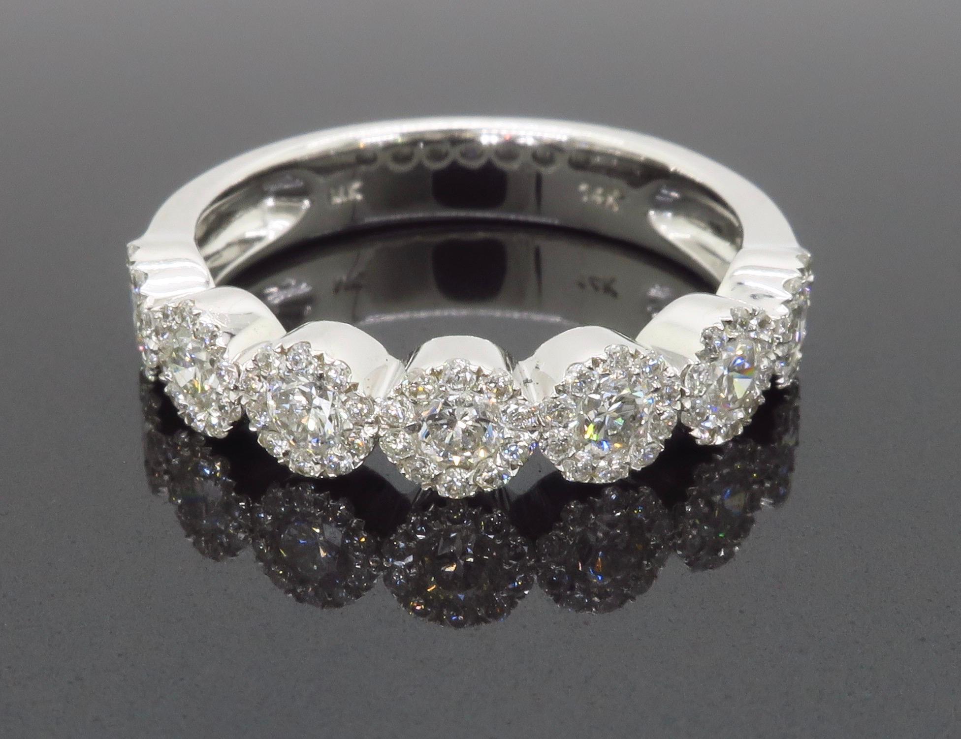 Five stone diamond halo band made in 14k white gold. 

Diamond Cut: Round Brilliant
Total Diamond Carat Weight: Approximately .70CTW
Average Diamond Color: F-G
Average Diamond Clarity: VS-SI
Metal: 14k white gold
Stamped: 