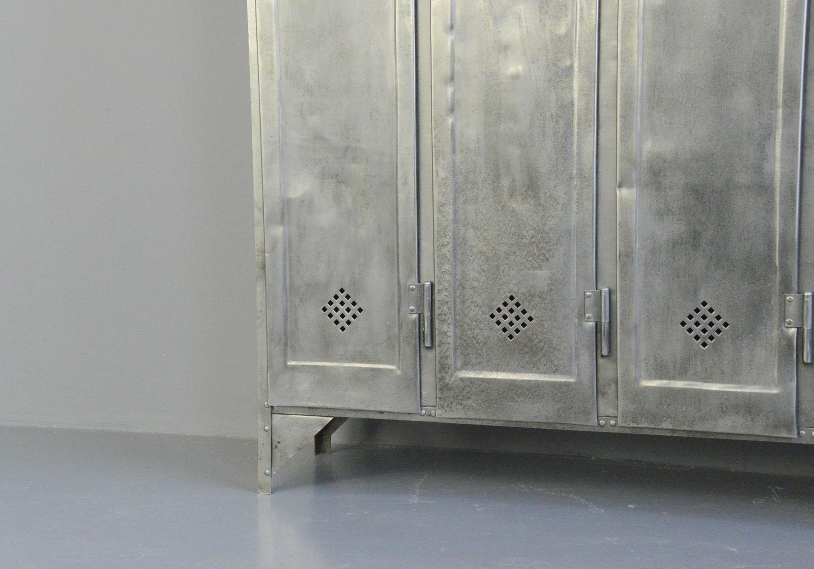 Five-door industrial lockers by Otto Kind, circa 1920s

- Made from sheet steel
- Diamond shaped vents
- 4 hanging hooks and 1 shelf in each compartment
- Made by Otto Kind
- German, 1920s
- Measures: 151cm wide x 33cm deep x 175cm