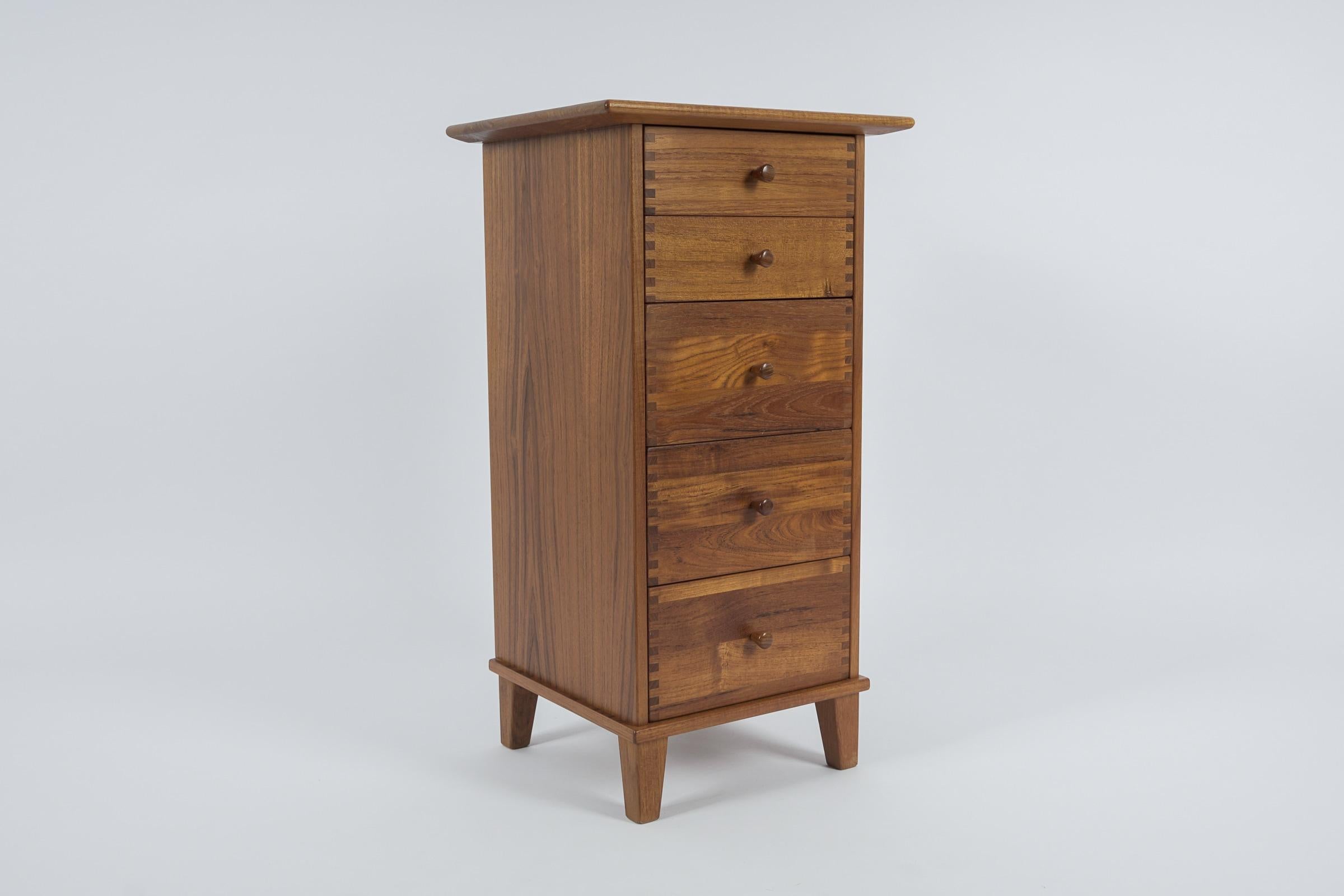 A gorgeous Danish modern five-drawer teak lingerie chest by Aksel Kjersgaard.

Ca. 1980s. Made in Denmark.

The chest is exquisite. The quality is top notch with all solid wood dovetailed drawers and a finished back. The top has an overhang and