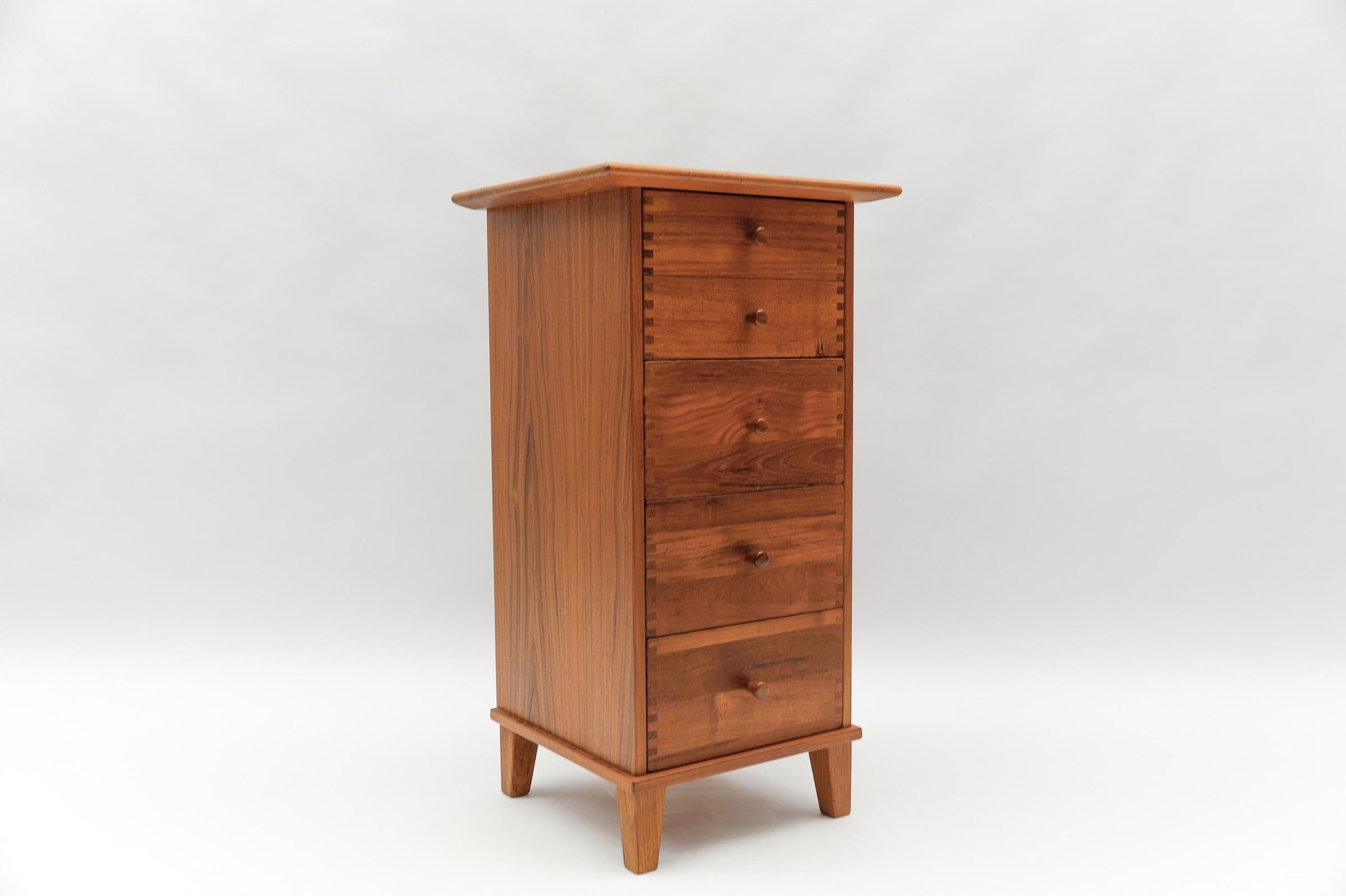A gorgeous Danish modern five-drawer teak lingerie chest by Aksel Kjersgaard.

Ca. 1970s. Made in Denmark.

The chest is exquisite. The quality is top notch with all solid wood dovetailed drawers and a finished back. The top has an overhang and
