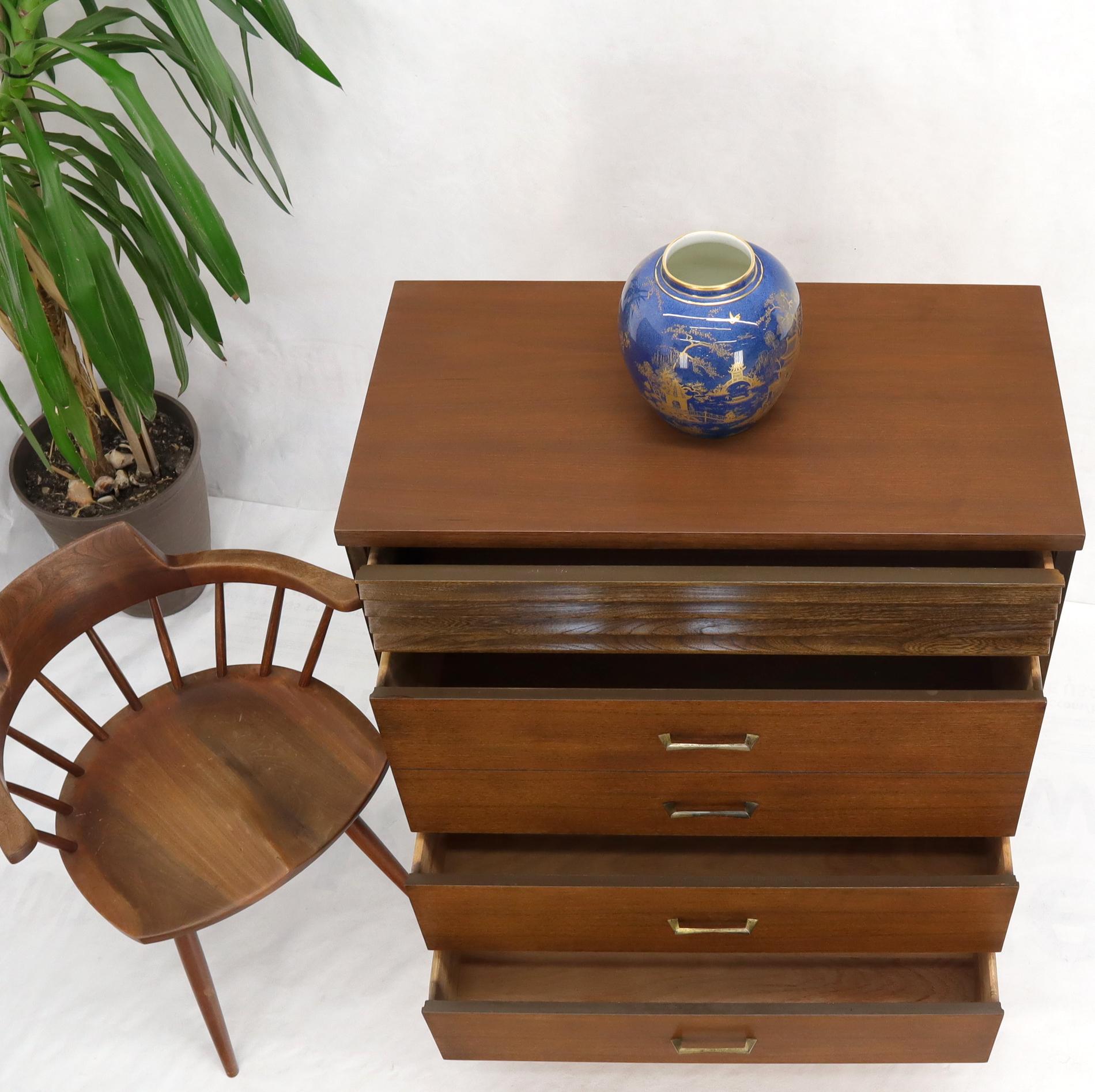 Mid-Century Modern five drawers walnut hi chest dresser cone shape legs with fluted brass tips.