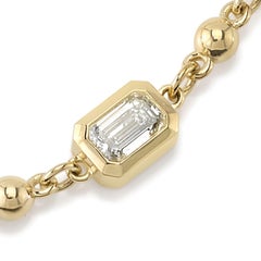 Five Emerald Cut Diamonds Set in a Handcrafted Yellow Gold Rosary Bracelet