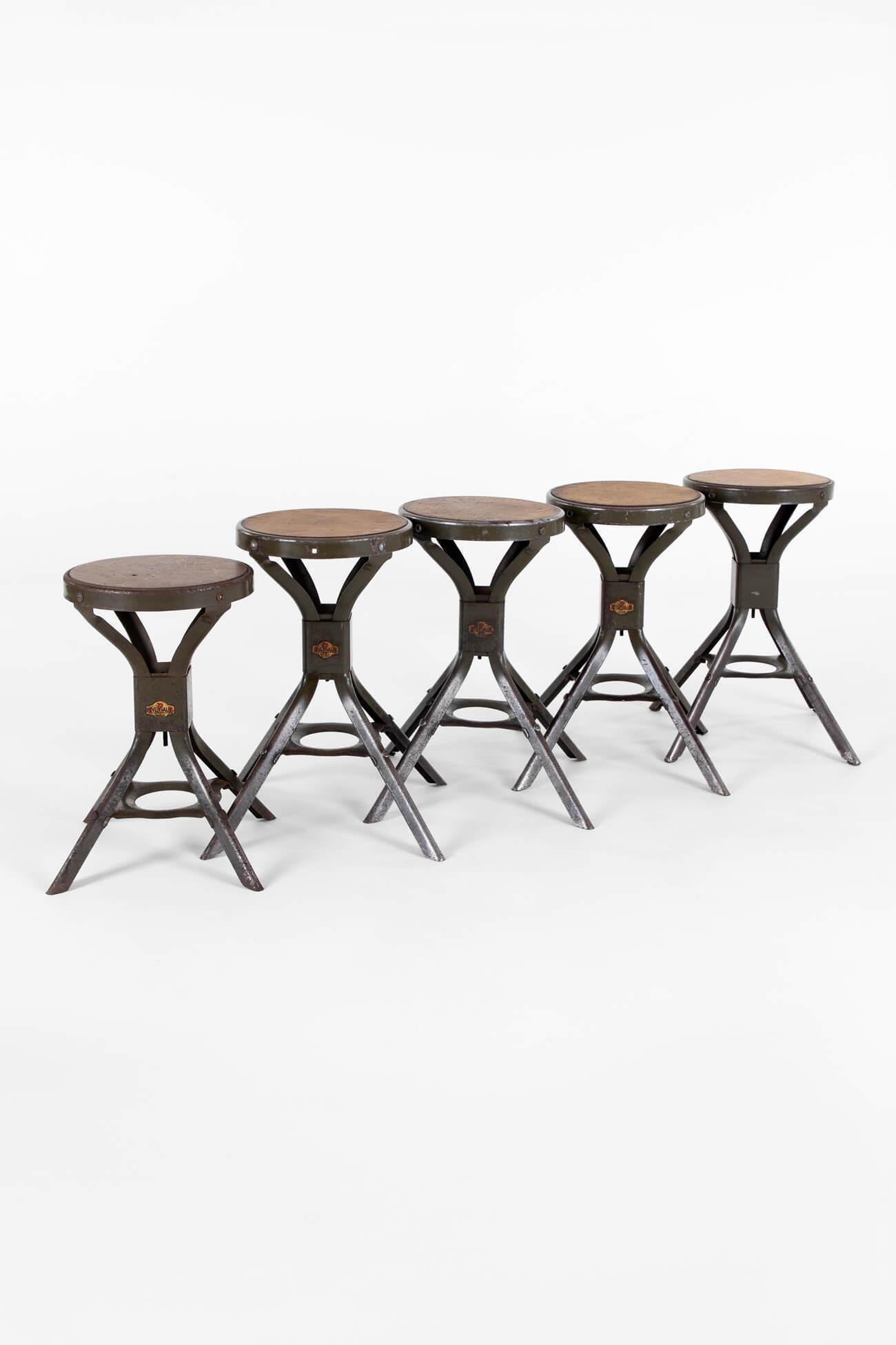 A group of eight industrial work stools by British seating company Evertaut.

These examples retain the original pitch pine seats and company badge logos at the base of the four splayed legs.

In original, strong and clean condition, ready to be