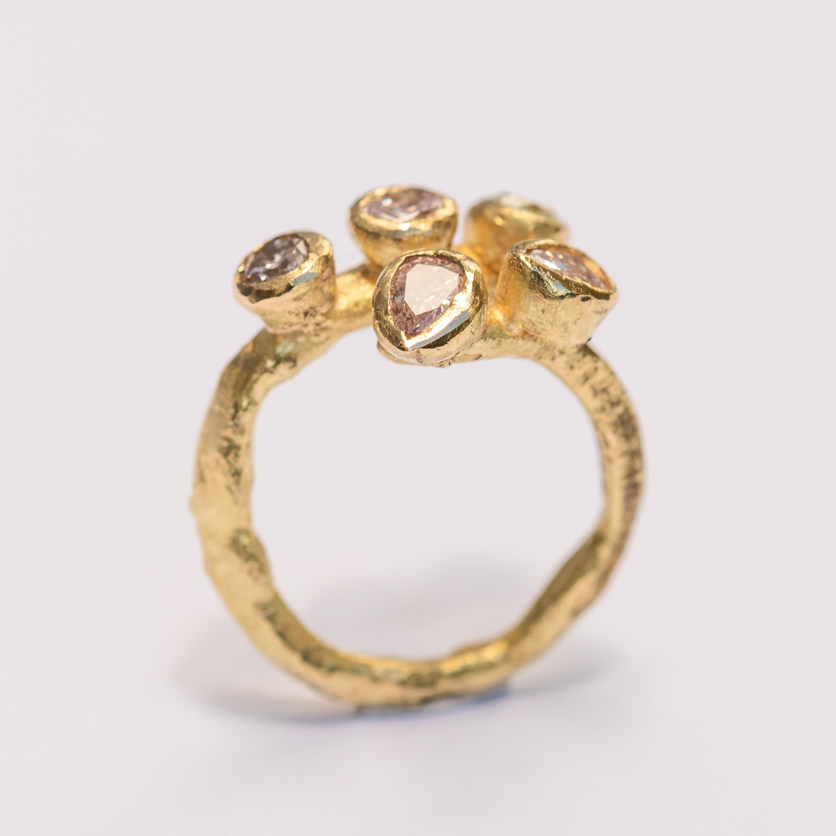 18k yellow gold textured open ring with five fancy coloured diamonds, various shapes and colours: 
x2 pear-shape pink 5mm x 4mm
x1 round green 4mm
x1 round pink 4mm
x1 round grey 4mm

This is a fabulous alternative bridal ring or a sparkling