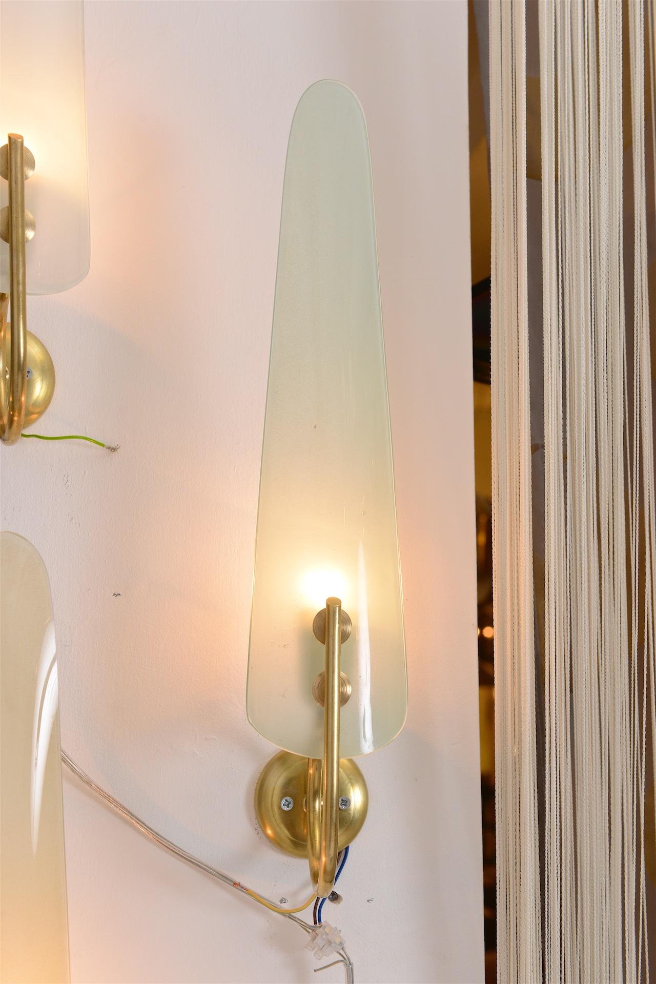 Lovely quality wall lights in different pastel colored glass with brass.

Three lights available in pastel  blues

 