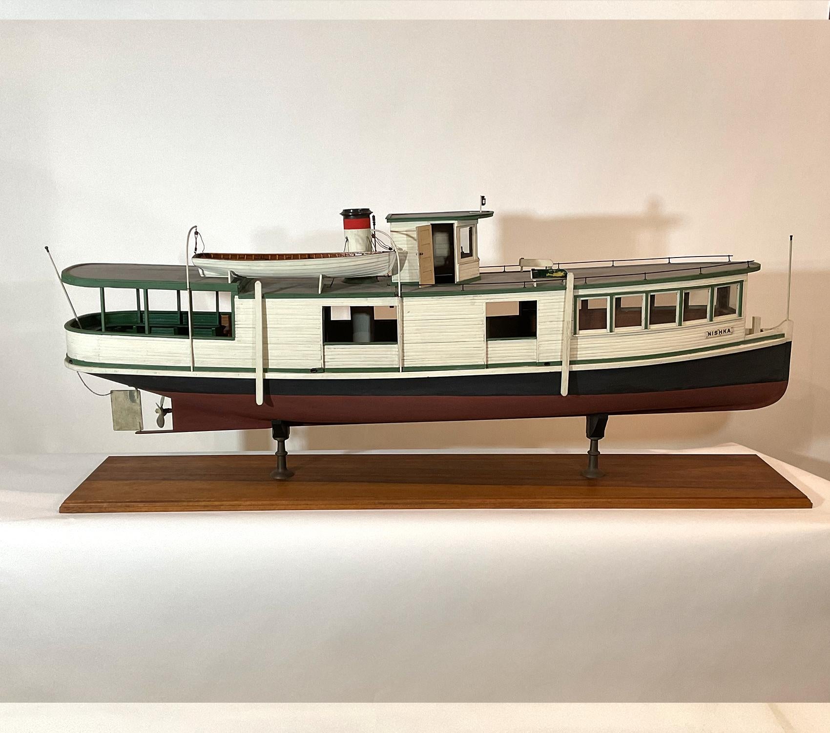 Plank on frame model of the ferry boat Nishka. With built up cabins, wheelhouse, launch, funnel, benches, flagstaffs, sidelights, quarter boards, etc. Nishka served the northwest for many years. Formerly in the collection of the Museum of Science