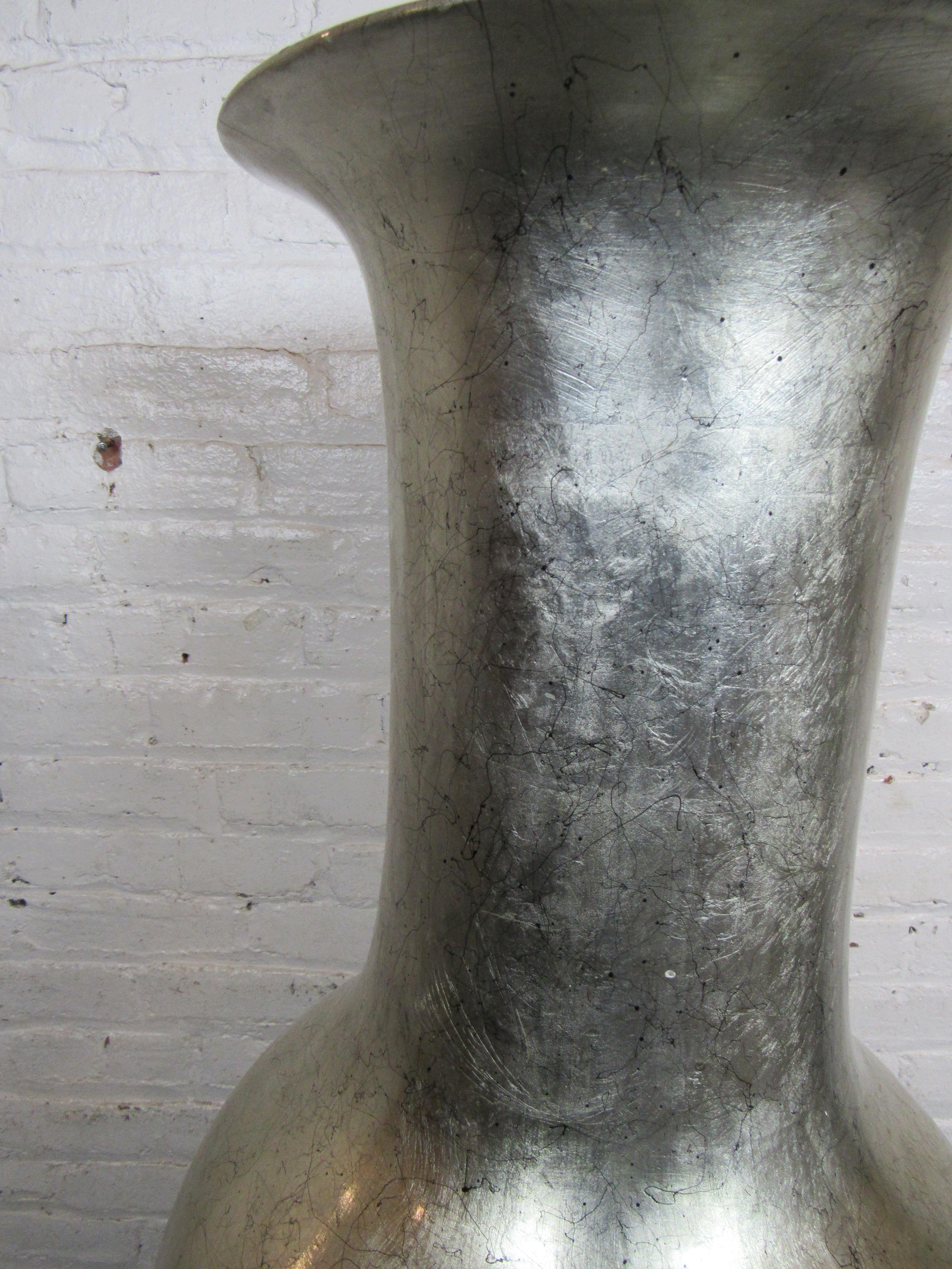 This striking bamboo floor vase in silver and black speckle paint. Sitting over five feet tall.
Please confirm location NY or NJ