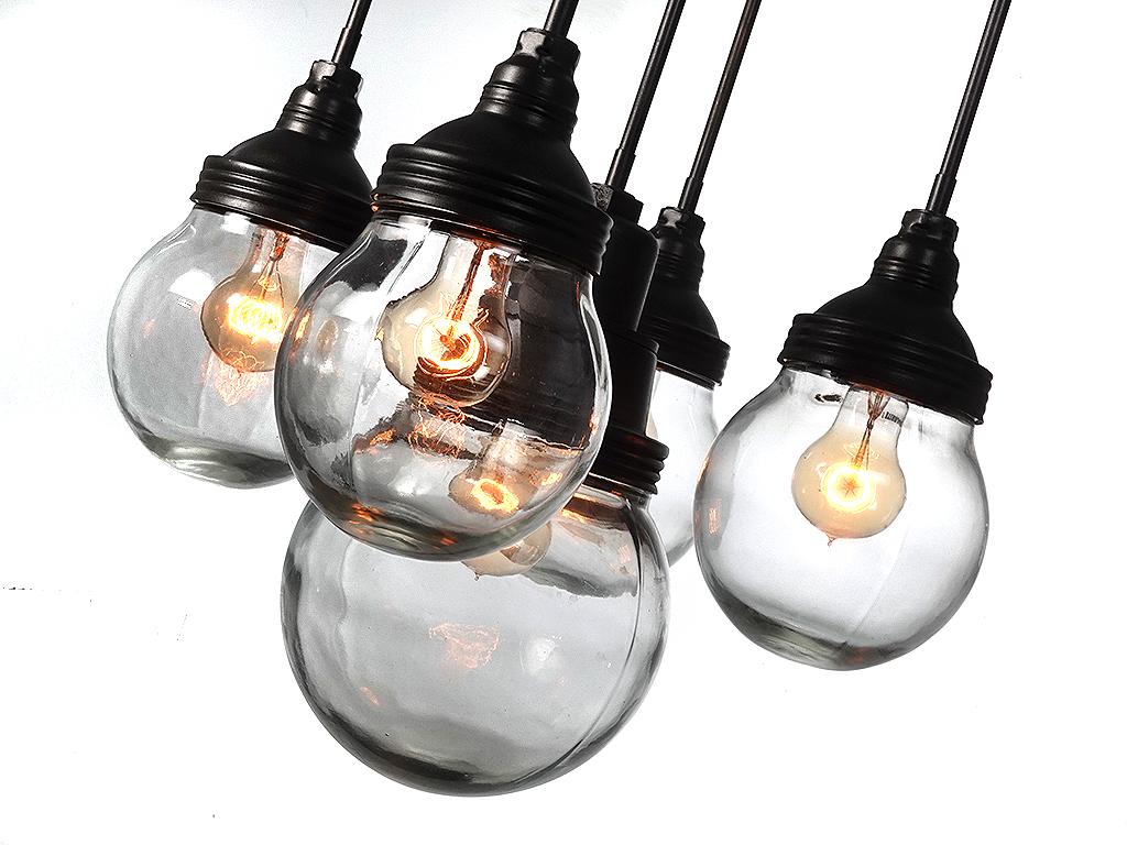 Stroll into New York, Park Avenue Armory you will see the striking multi-globe lamps in the front lobby. This amazing Benjamin style explosion proof Industrial chandelier has that early municipal look. The lamp is an impressive 18 inch diameter and