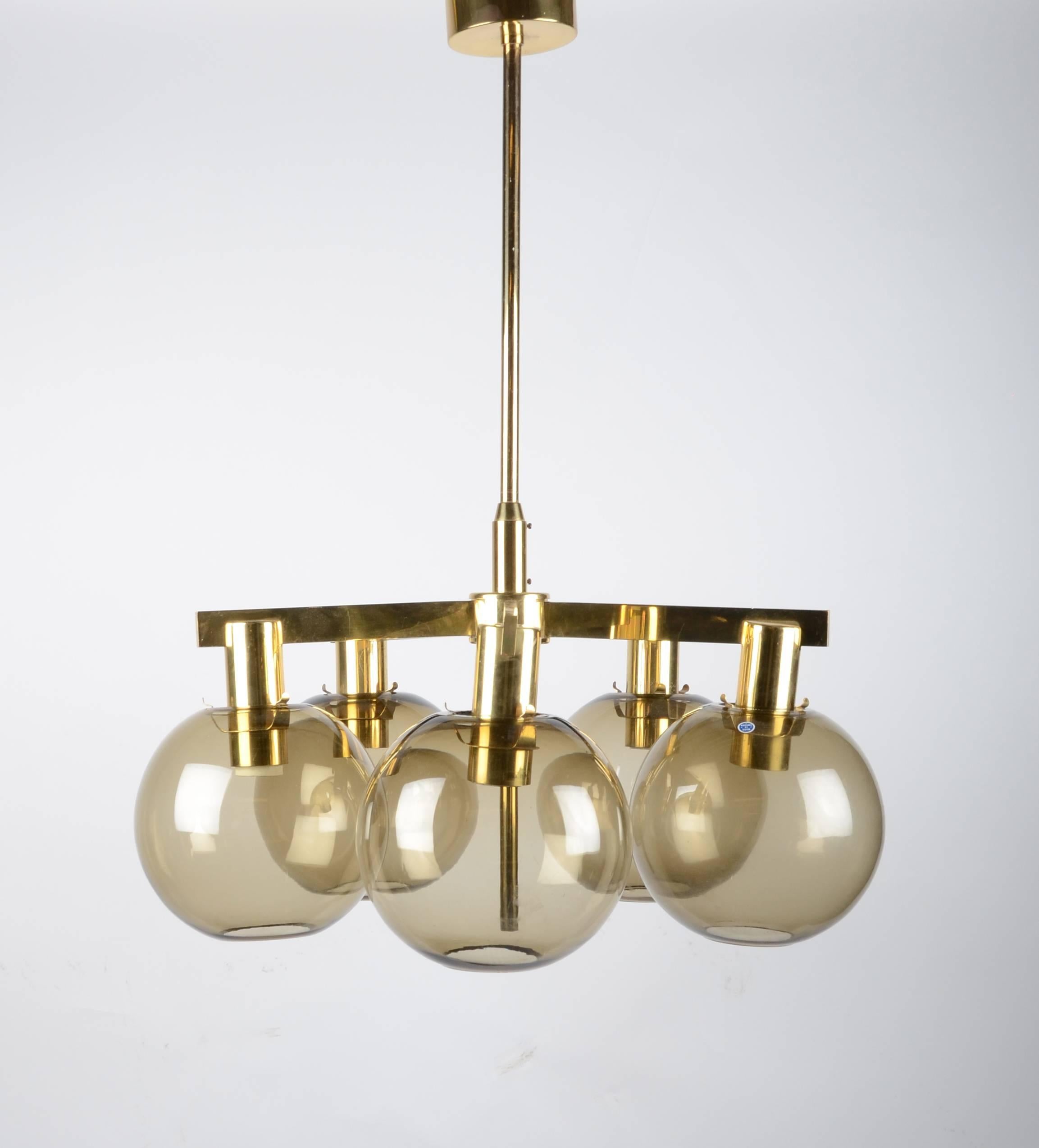 Chandelier in brass with five glass globes. Designed by Hans-Agne Jakobsson for Markaryd, Sweden, 1960s.