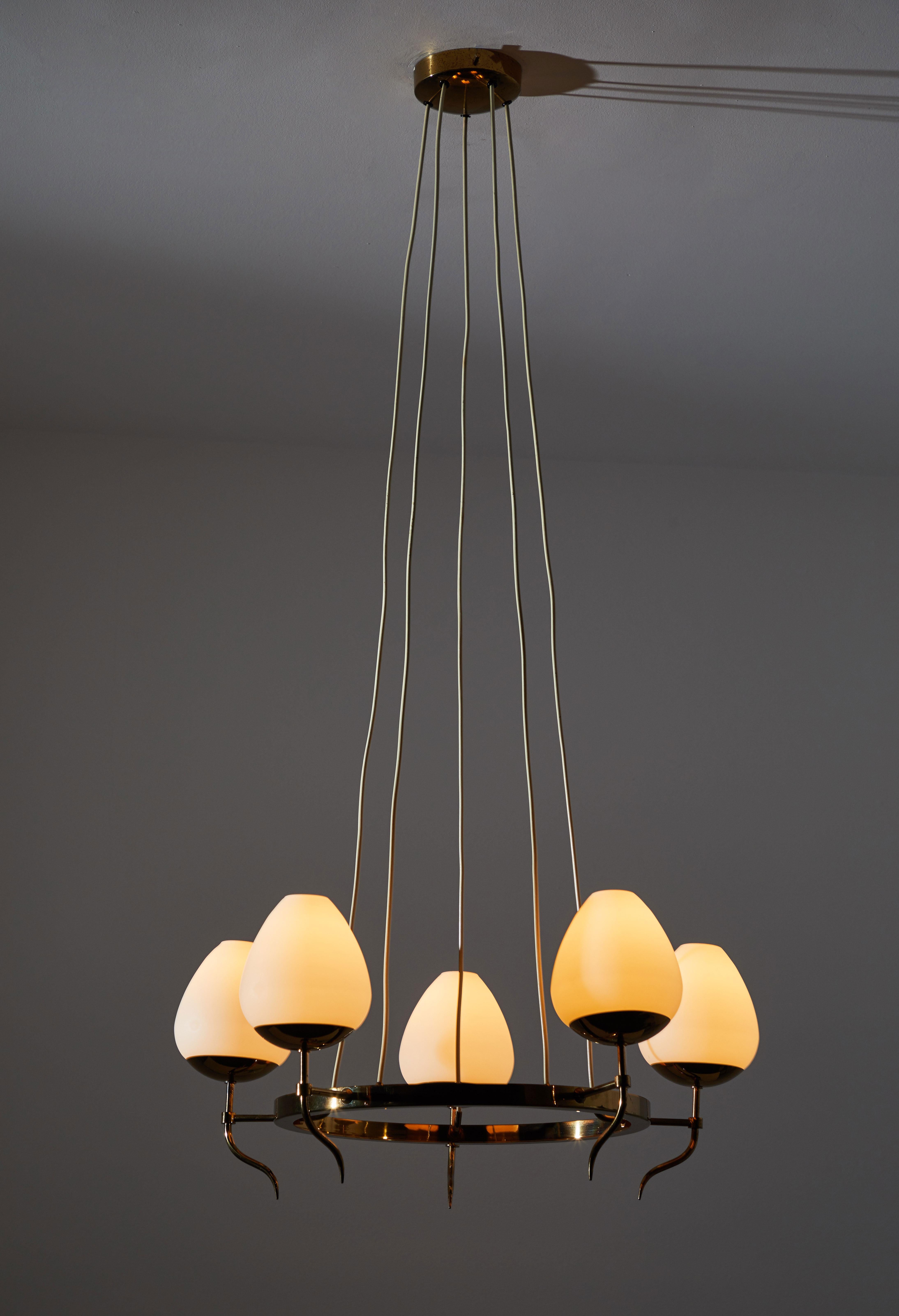 Five globe chandelier by Stilnovo. Manufactured in Italy circa 1950s. Brass with brush satin glass diffusers. Original canopy, custom ceiling plate. Rewired for US junction boxes. Takes five E27 25w maximum bulbs.