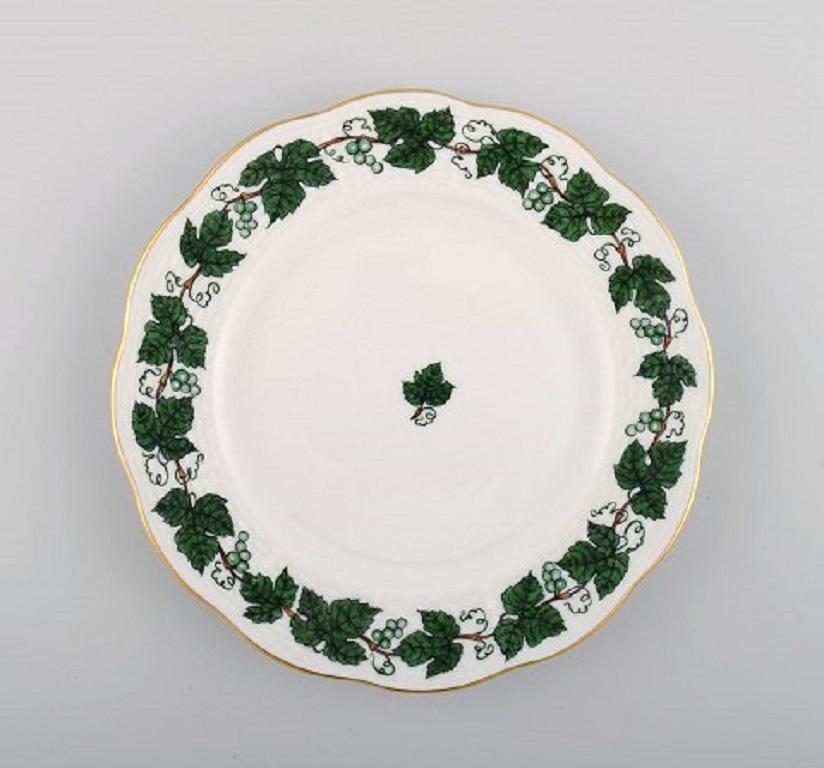 Five Herend green grape leaf & vine side plates in hand-painted porcelain. 
Mid-20th century.
Measure: Diameter: 17 cm.
In excellent condition.
Stamped.