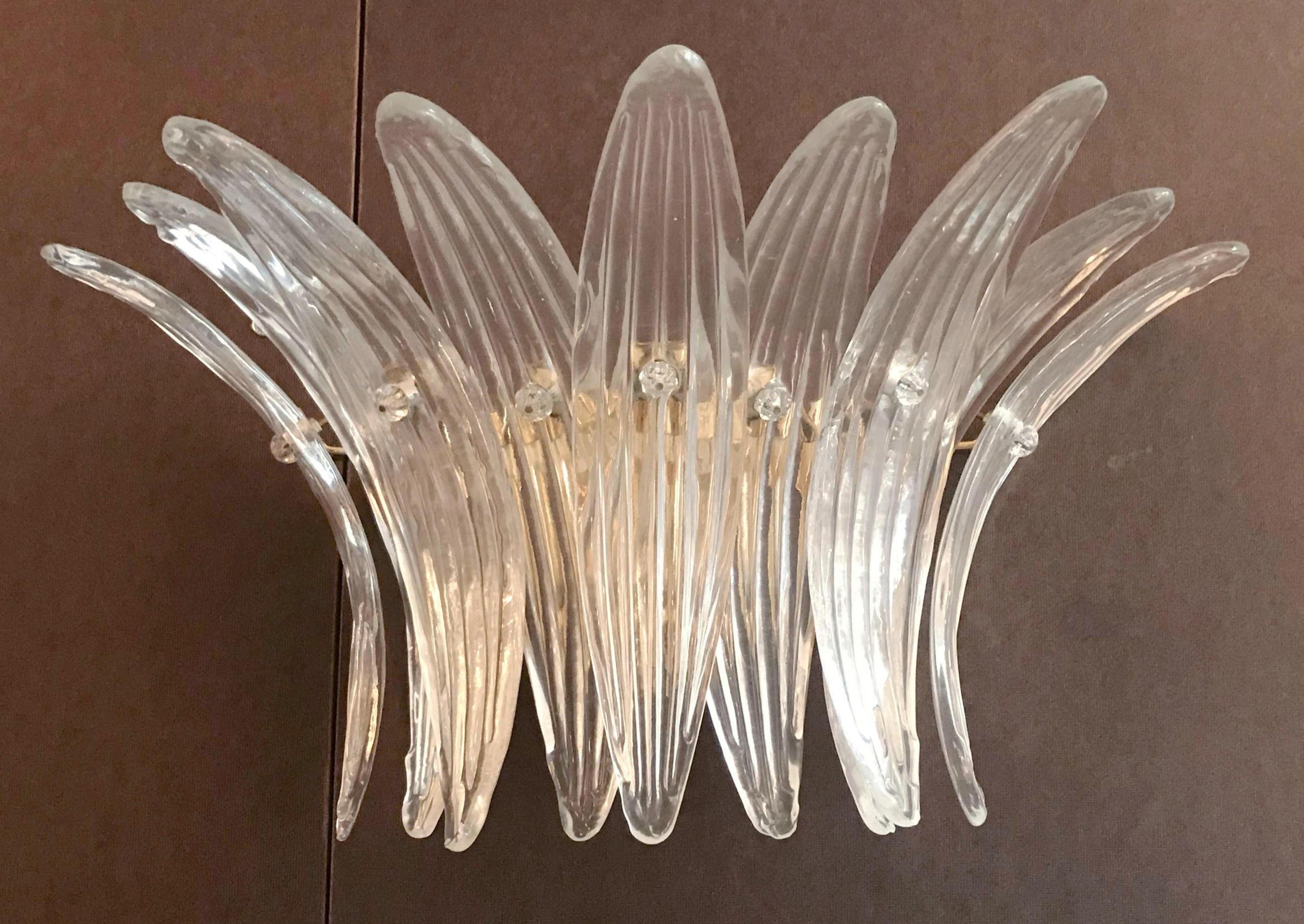 Pair of Italian wall lights with nine hand blown clear Murano glass leaves, mounted on 24-karat gold plated metal frames / Made in Italy.