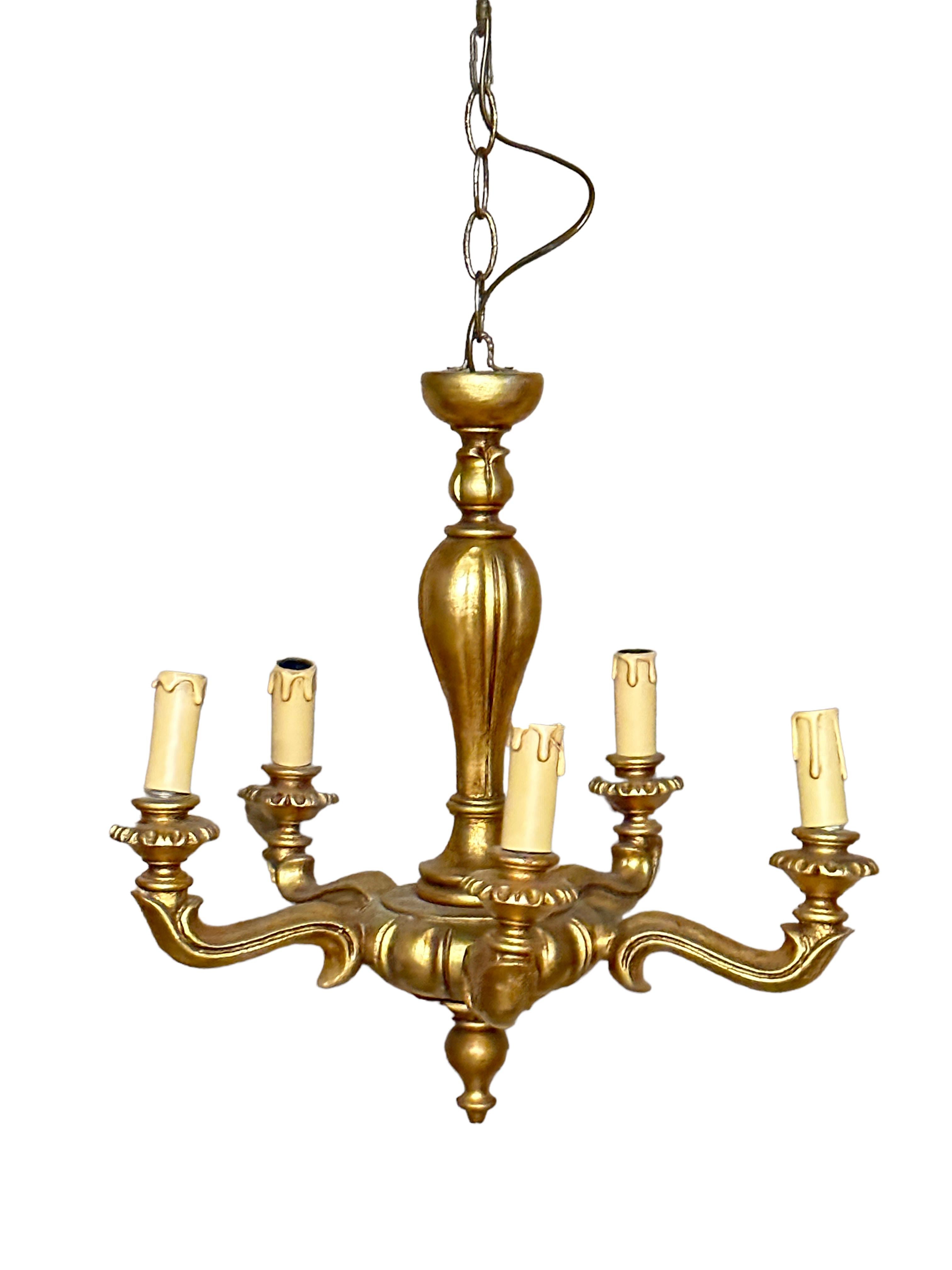 Add a touch of opulence to your home with this charming chandelier! Perfect gilt wood and hand carved chandelier to enhance any chic or eclectic home. We'd love to see it hanging at a dinning place as a charming welcome. The chain with canopy is