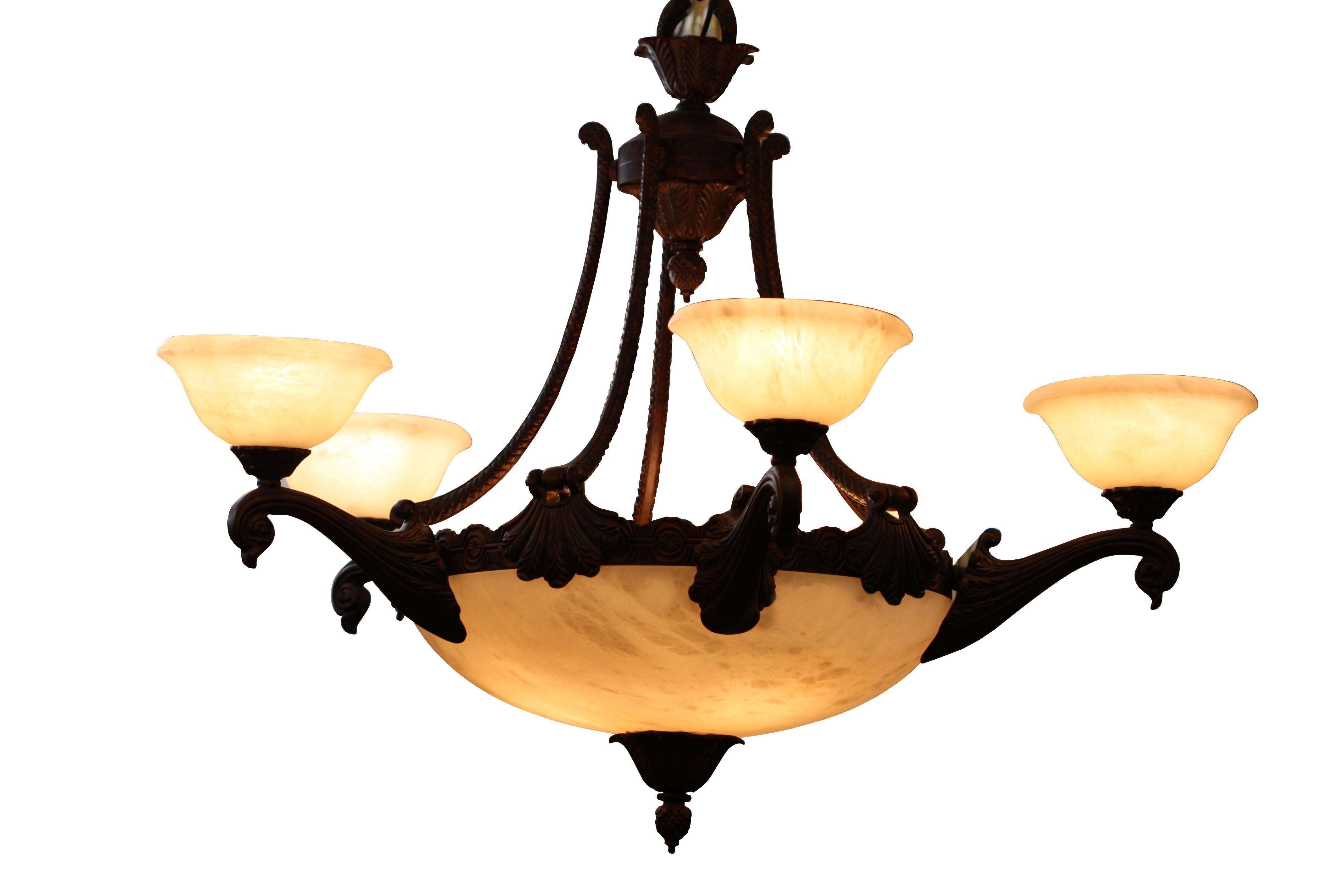 Five light Italian alabaster and bronze chandelier, fourth quarter of the 20th century. Measures: Height 24 in. (60.96 cm.)
Width 33 in. (83.82 cm.).
