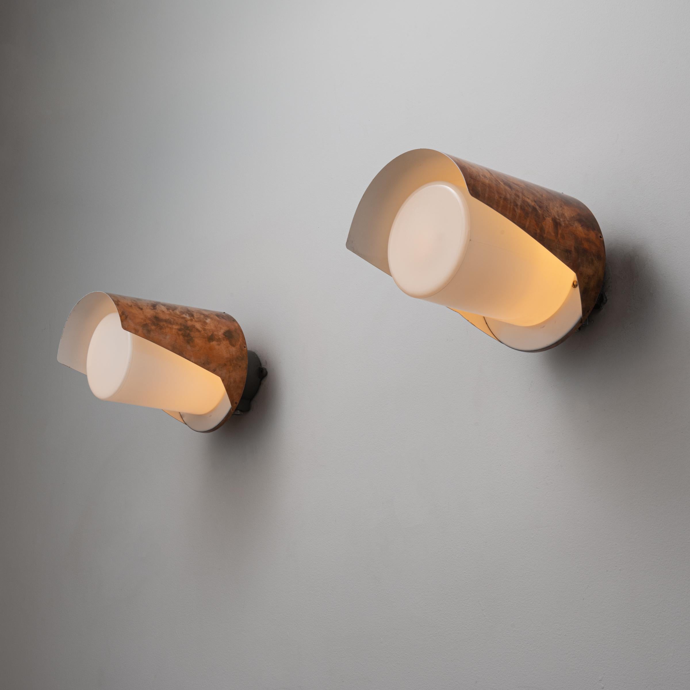 Five Model AT32 Sconces by Itsu. Manufactured in Finland, circa 1960's. Copper shade, cylindrical opaline glass diffuser. Rewired for U.S. standards. Custom backplates. We recommend one E27 60w maximum bulb per sconce. Bulbs not included. 
