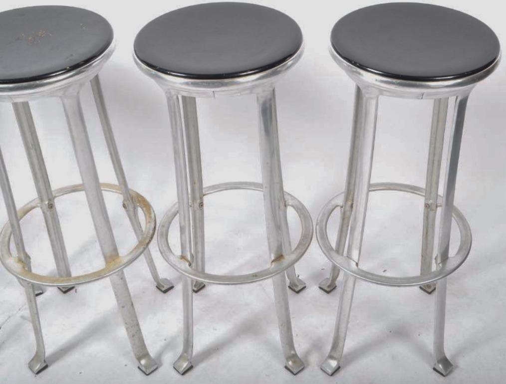 Five modern aluminum bar stools - strong, lightweight, corrosion resistant and stylish. Can be utilized outside or inside. Comfortable - padded seats and a well-thought-out foot support ring. Joan Casas designer for Indecasa.