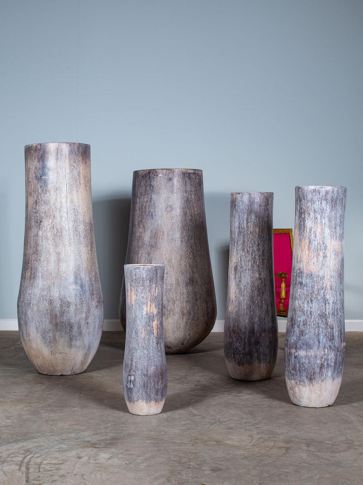 A set of five organic modern palmwood planter pots from Sumatra Indonesia hand rubbed with a grey washed finish. Natural sculptures enhanced by contemporary imagination. Please enlarge all the photographs to see the unique details in closeup. The