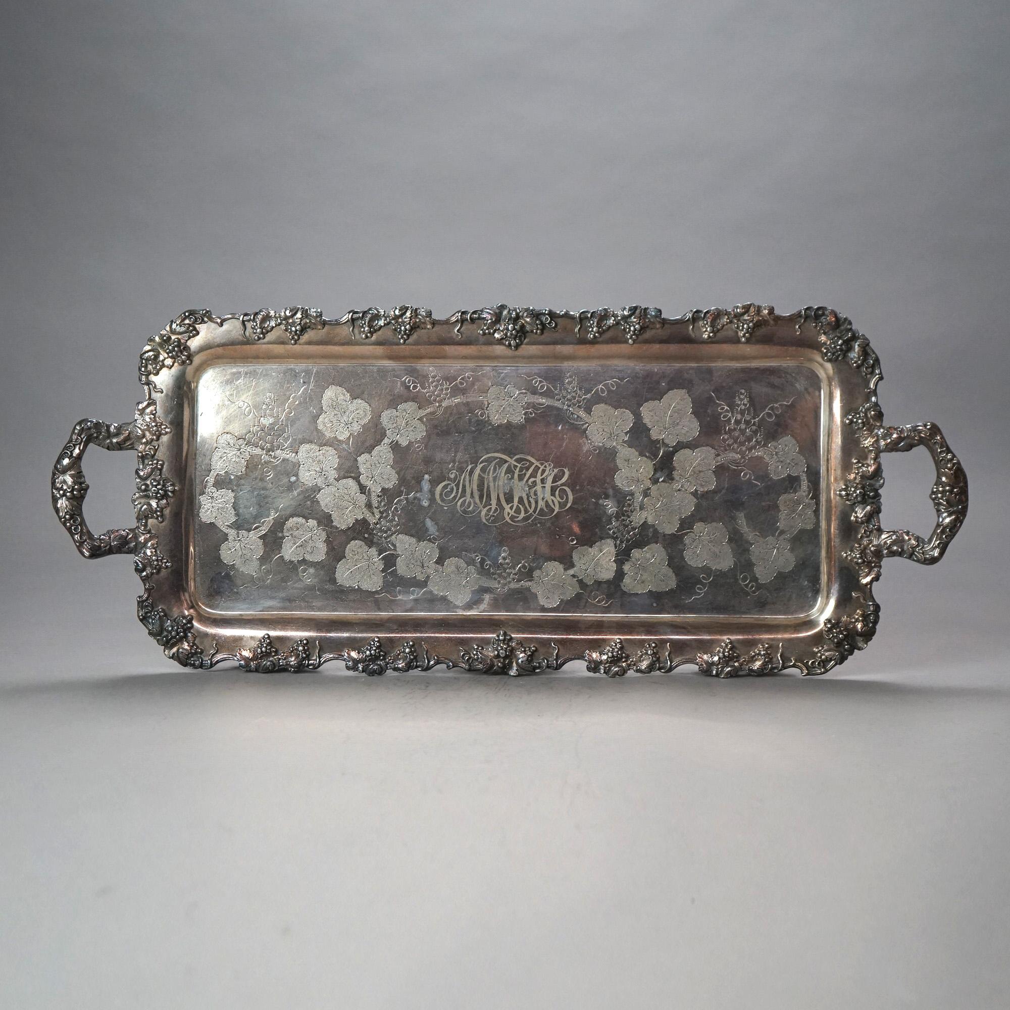 Juego de té antiguo de cinco piezas bañado en plata con grabado de hojas y frutas y monograma C1890

Medidas - 11,25 