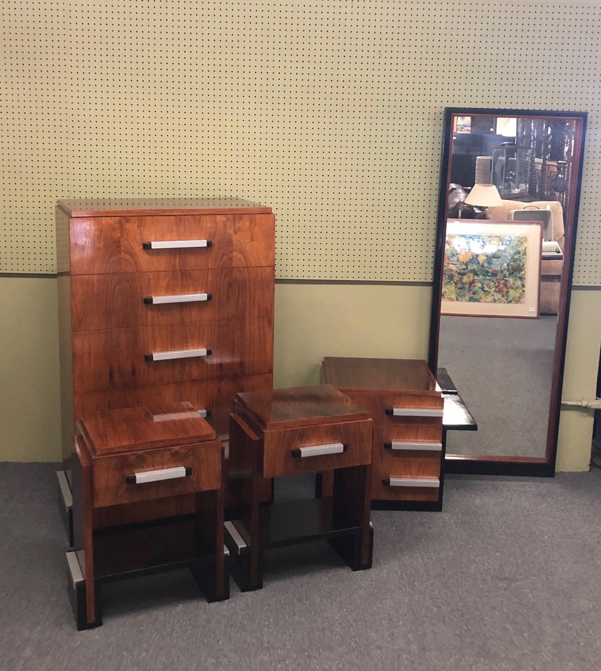 Spectacular five-piece Art Deco bedroom set in rosewood by Donald Deskey for John Widdicomb, circa 1930s. The set has been professionally refinished and restored and is in very good vintage condition. Included is a five-drawer dresser, a