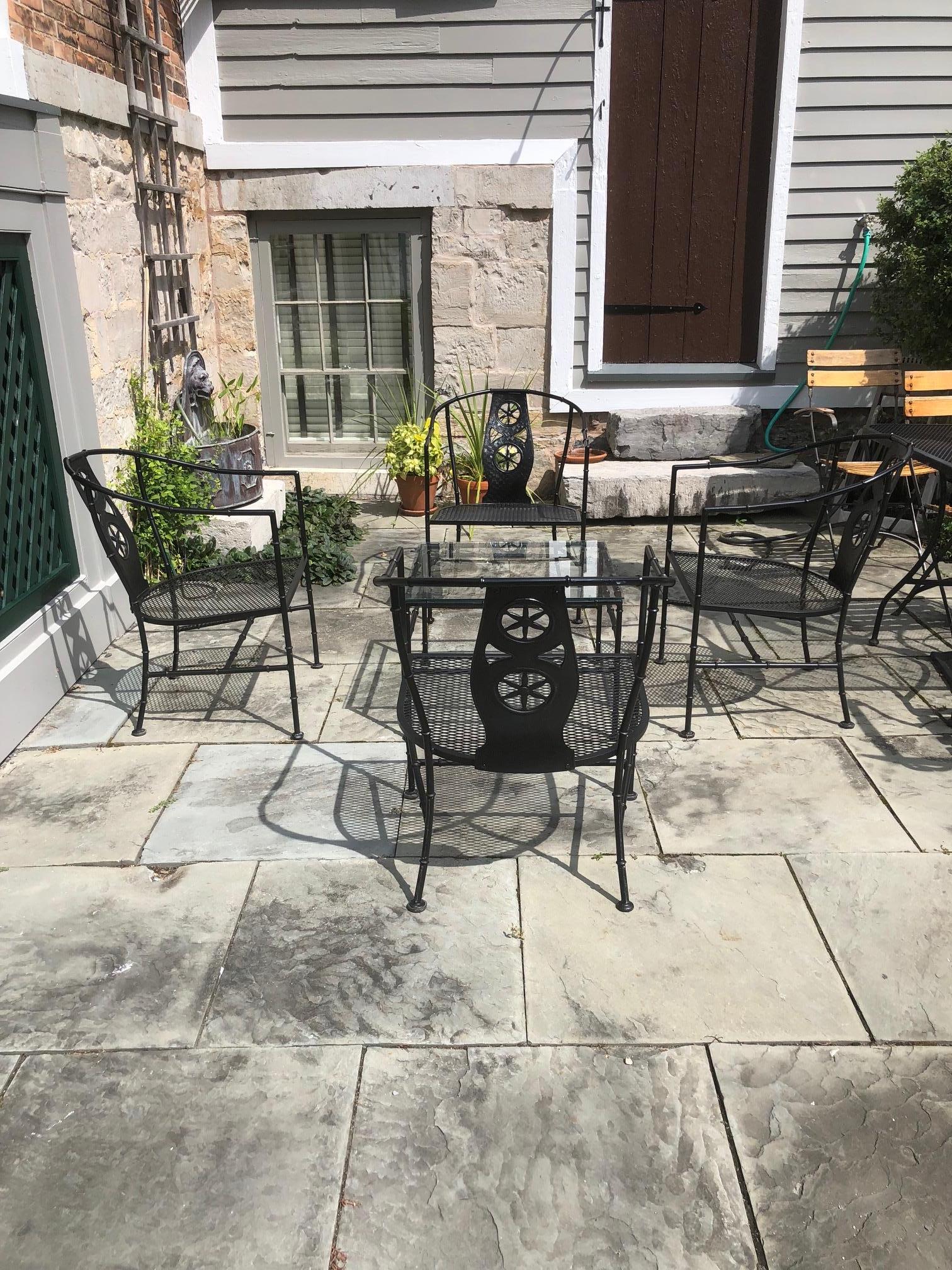This stylish 5-piece set of patio furniture is from the Montego collection designed by Maurizio Tempestini for Jonh Salterini in the 1960s. 

The set consist of four arm chairs and one table.

Note: Dimensions of table are 16.75