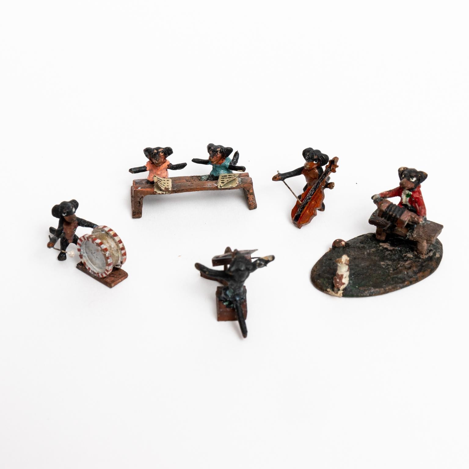 Five piece Austrian cold painted bronze miniature Dachshund band. The figurines include a drummer, cellist, conductor, two singers, and an accordion player. Please note of wear consistent with age. The figurines measure from 0.25 to 1.50 Inches