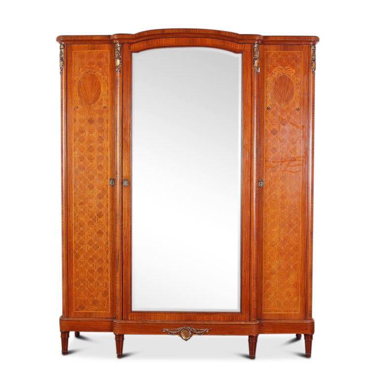 French Louis XVI-style inlaid satinwood bedroom suite, consisting of a 3-door armoire, a pair of matching nightstands, marble-top mirrored washstand, and a rare find - a queen-size bed frame. The pieces feature highly-detailed inlaid classical