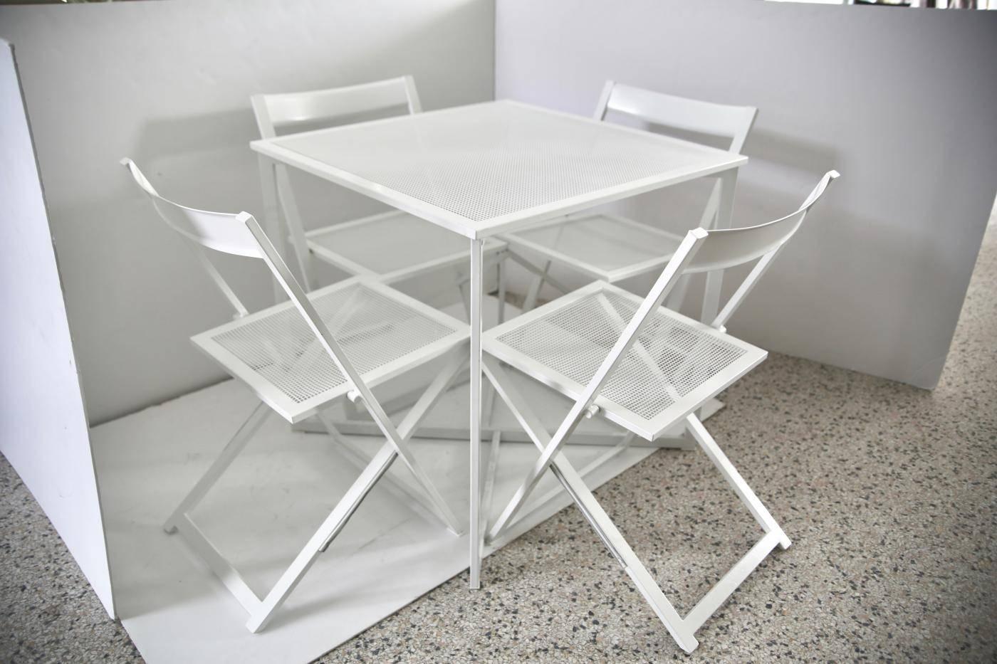 This patio set dates to the 1970s and has recently been professionally powder-coated in white and will make the perfect addition to your terrace, poolside or garden escape. The chairs fold for storage and ease of use.

Table dimensions: Height