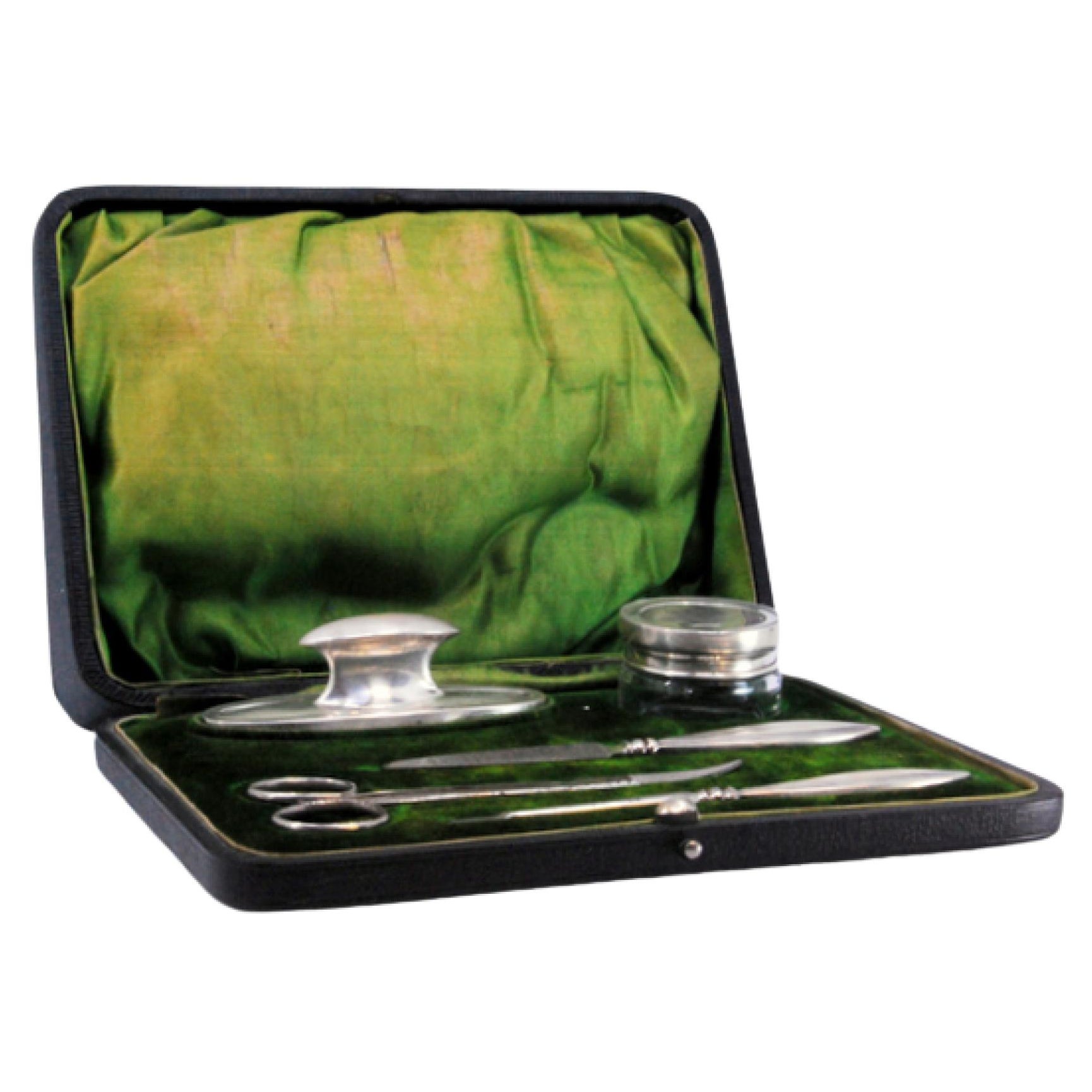 Five-piece silver manicure set with hard case and green velvet interior