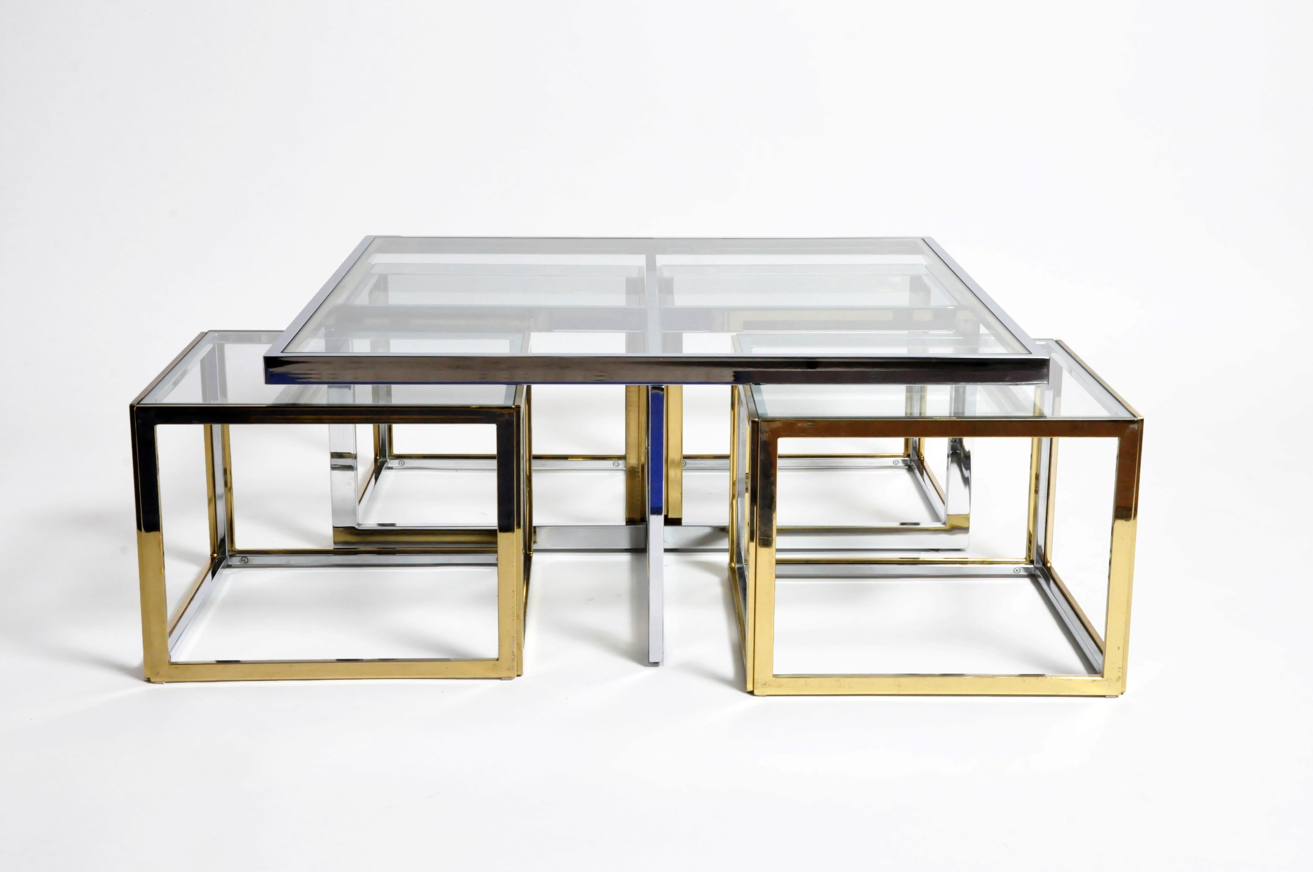 A rare Maison Jean Charles style low table made from chrome and glass coffee table ensemble in 5 parts. Manufactured and designed by Maison Jean Charles, France around 1970. Low Chrome table with 4 nesting cubes in brass and glass. Light scratches