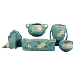 Five Pieces of Blue Roseville Art Pottery with White Rose Pattern Mid 20th
