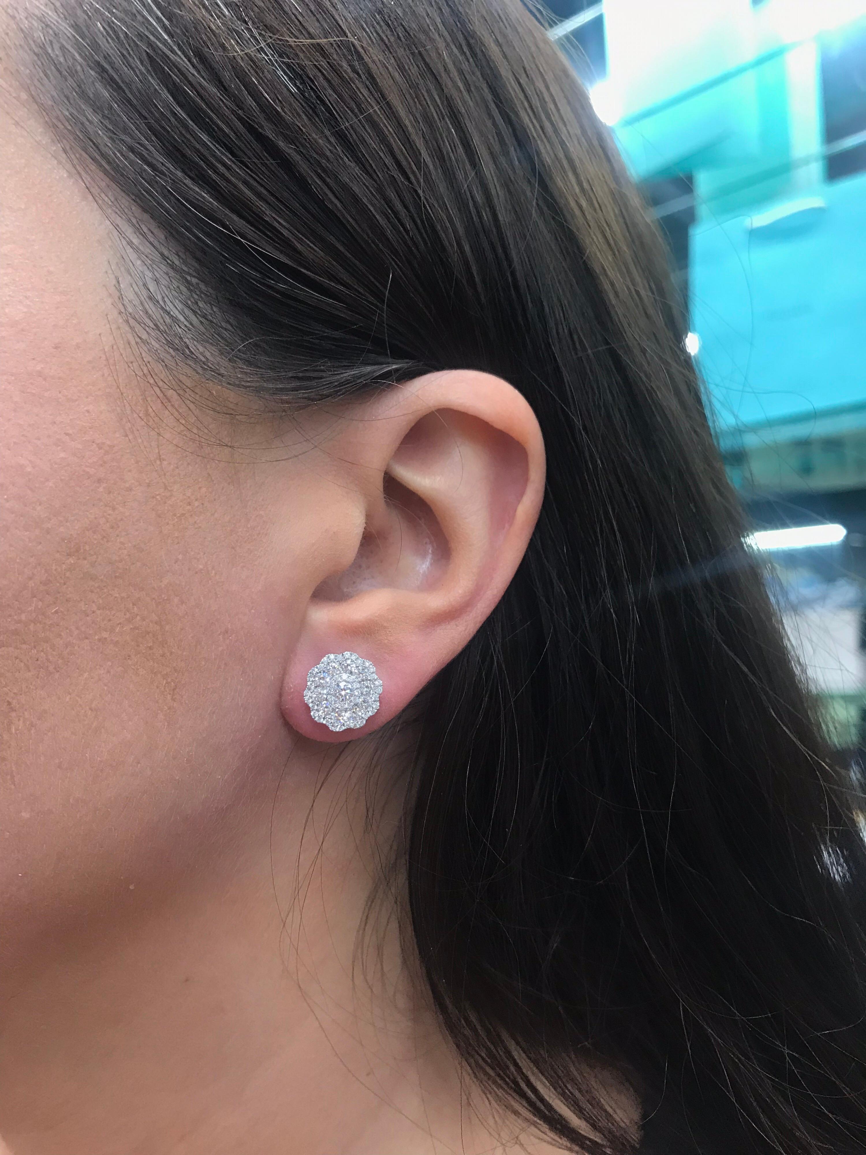 18K White Gold diamond cluster earrings featuring five rows of alternating sizes of round brilliants weighing 1.38 carats.
Color G
Clarity VS

A classic piece to add to your collection!