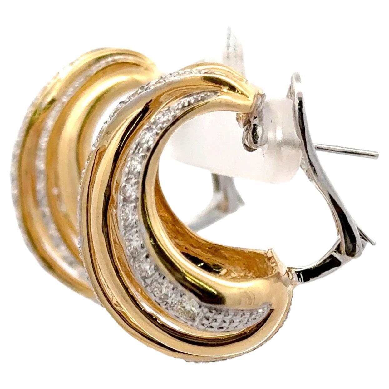 18 Karat yellow gold earrings featuring five rows of gold and diamond containing 68 diamonds weighing 2.37 carats.
Can be for pierced or non pierced earrings. 