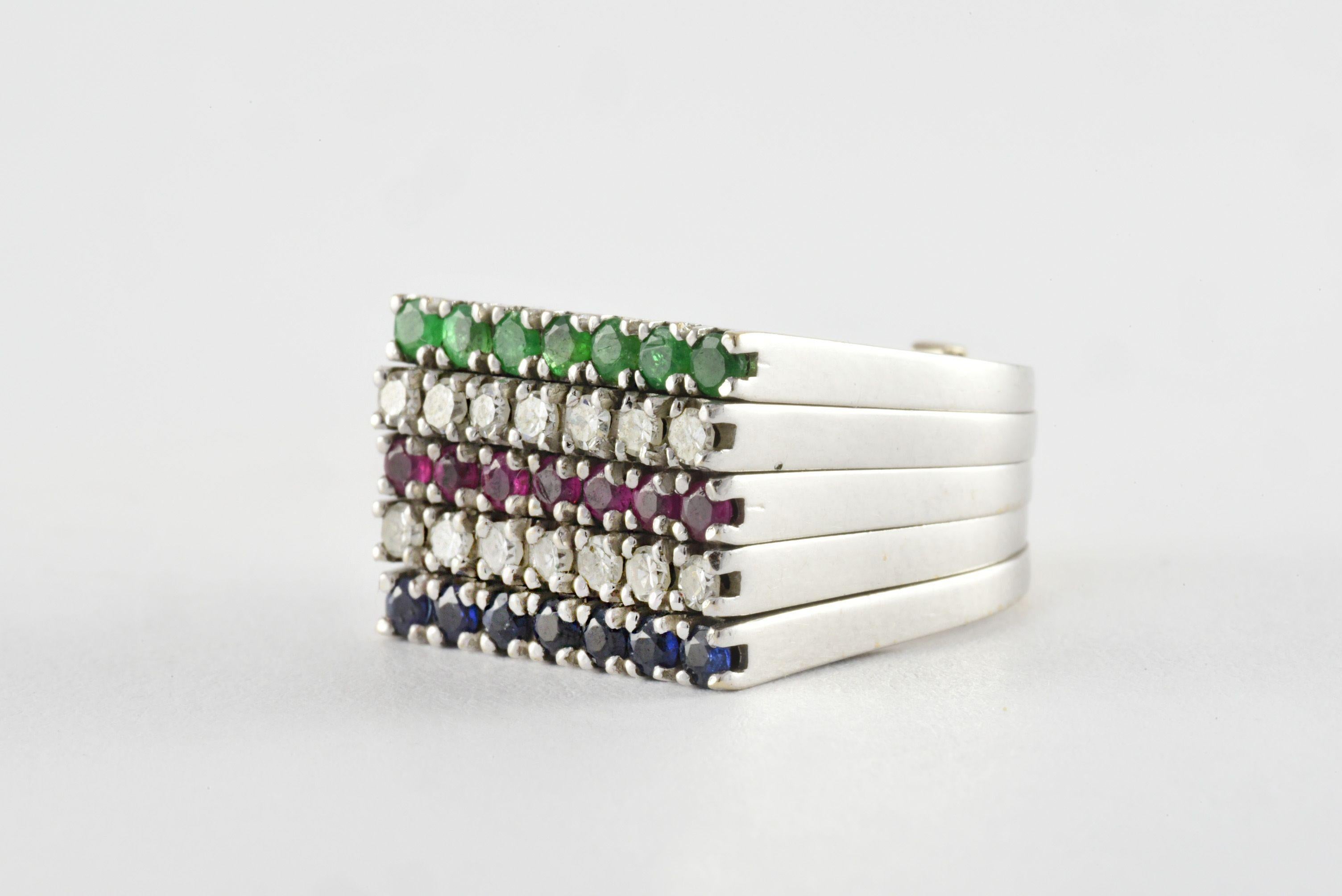 A vintage five row Harem Ring with five stacking bands set with green emeralds, diamonds, rubies, diamonds and sapphires -- in order -- mounted in 18kt white gold. Made in France. 




