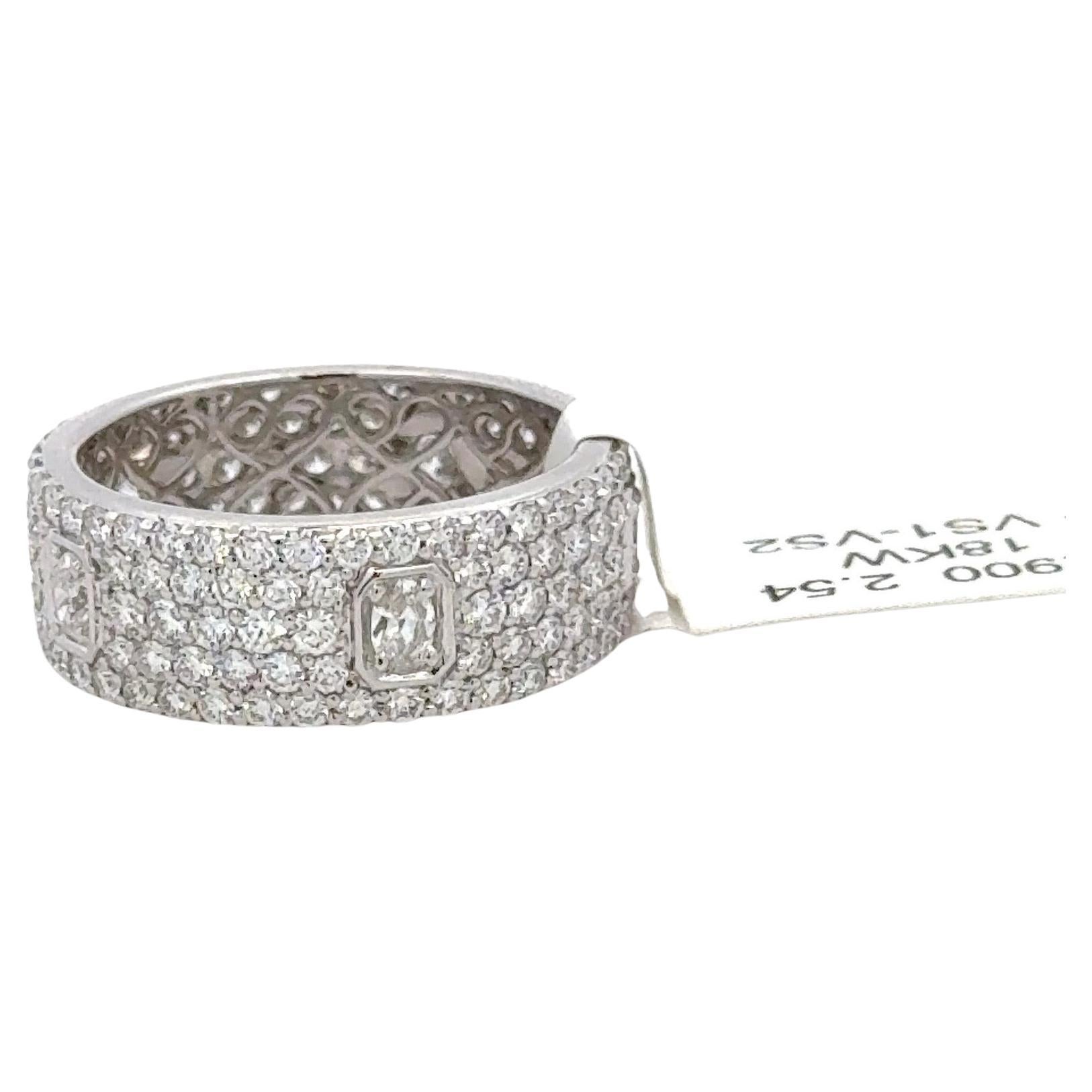 18 Karat white gold band featuring 5 rows of 165 round brilliants weighing 2.15 carats and 5 oval cut diamonds weighing 0.39 carats.
Very fashionable!
3 mm Band 
Size 7