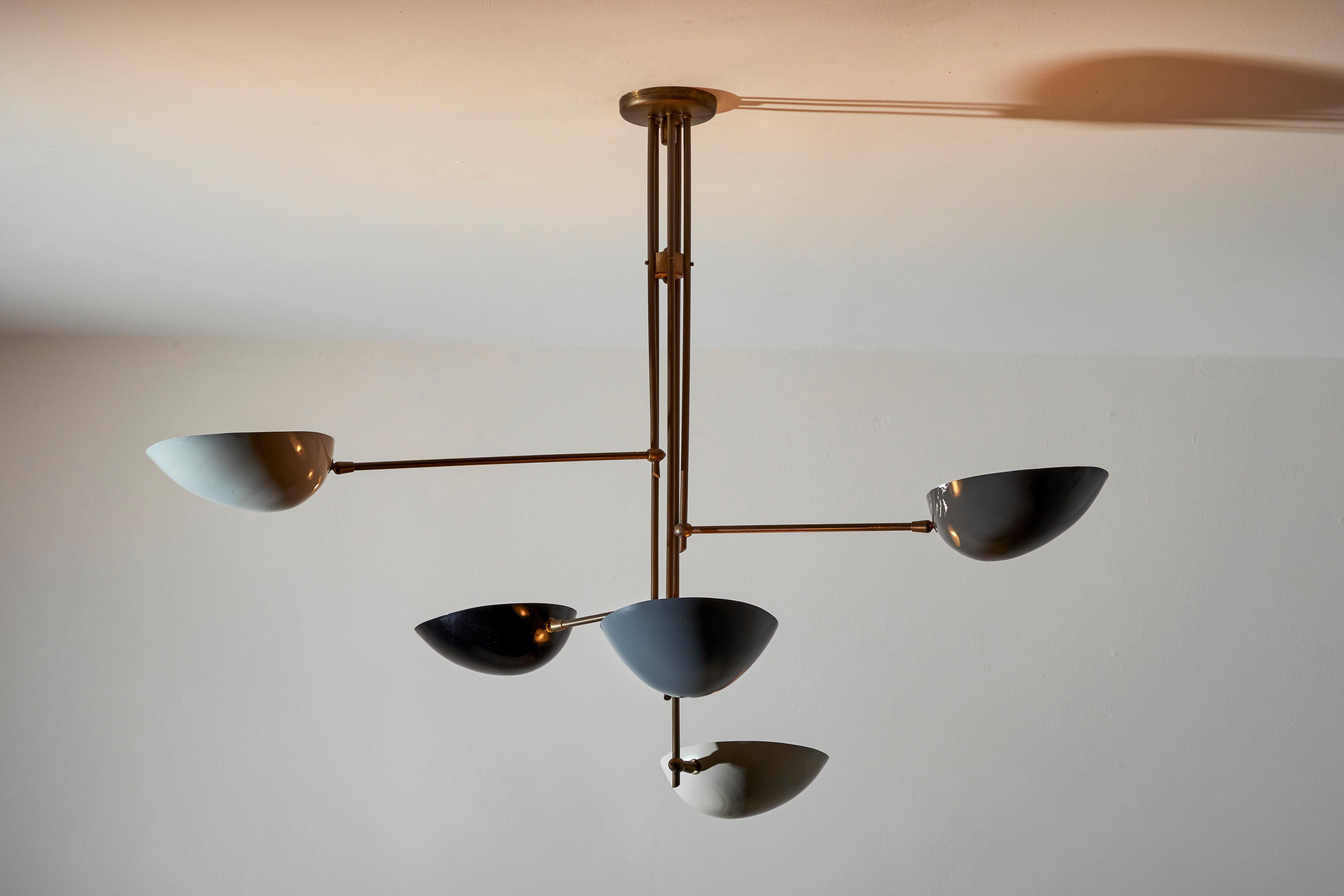 Five shade suspension light by Lumen. Manufactured in Italy, circa 1950s. Rewired for U.S. junction boxes. Enameled metal, brass. Custom brass ceiling plate. Takes five E26 60w maximum bulbs. Bulbs provided as a one time courtesy.