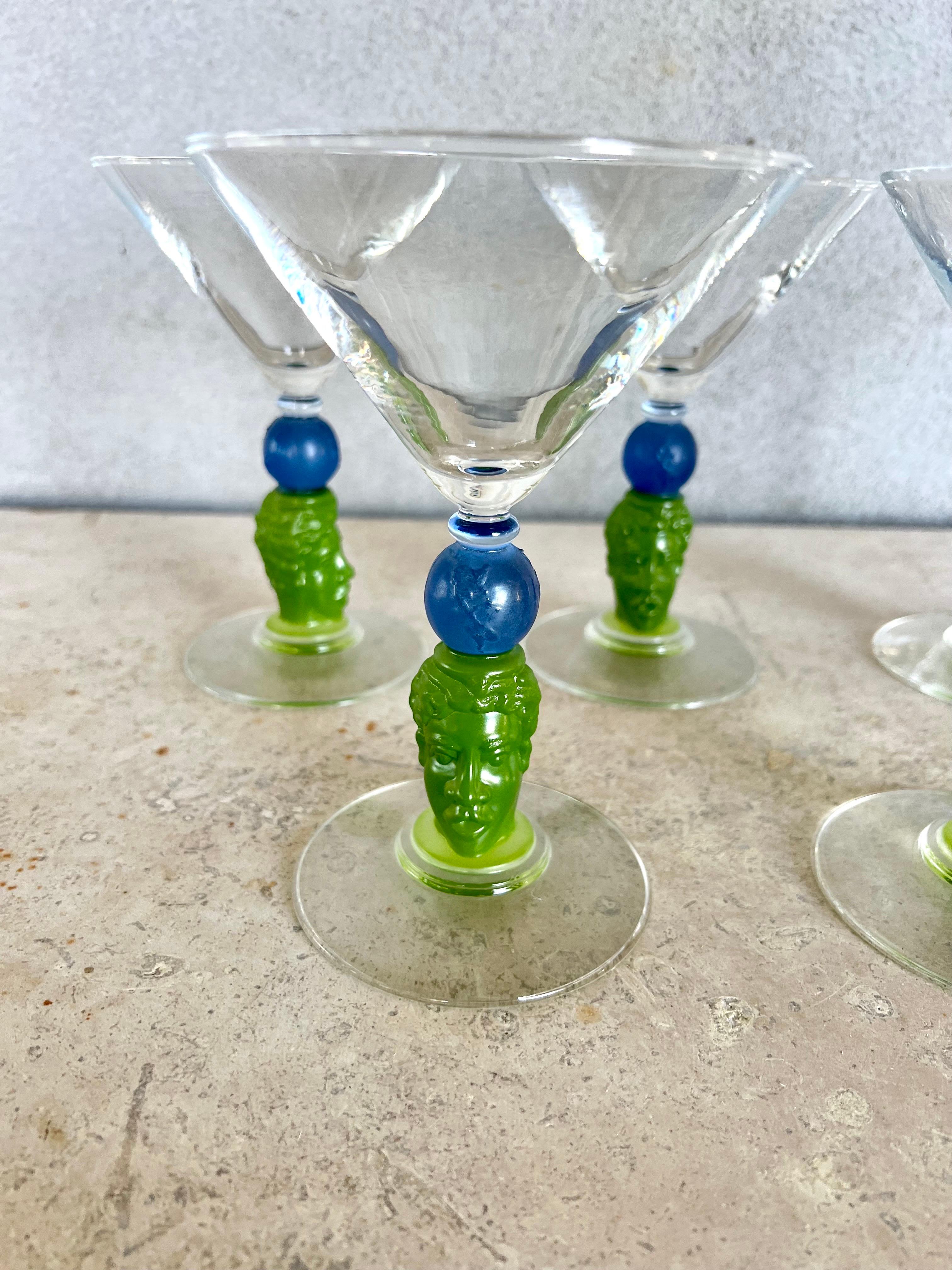 Five perfect sculptural signed glass barware by Richard Jolley in beautiful hues of green and blue glass with clear top and bottom. The stem is a carved face that he is known for with the world resting on top of it.These were a limited edition are